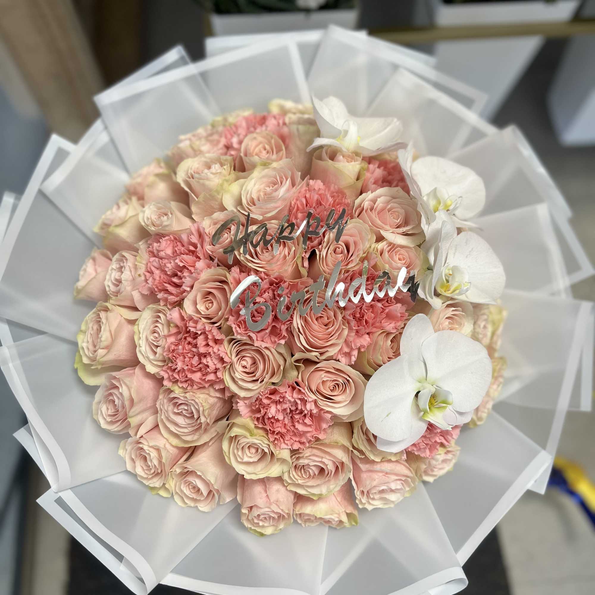 Elegant bouquet with 50 pink roses and carnations, combined with beautiful and