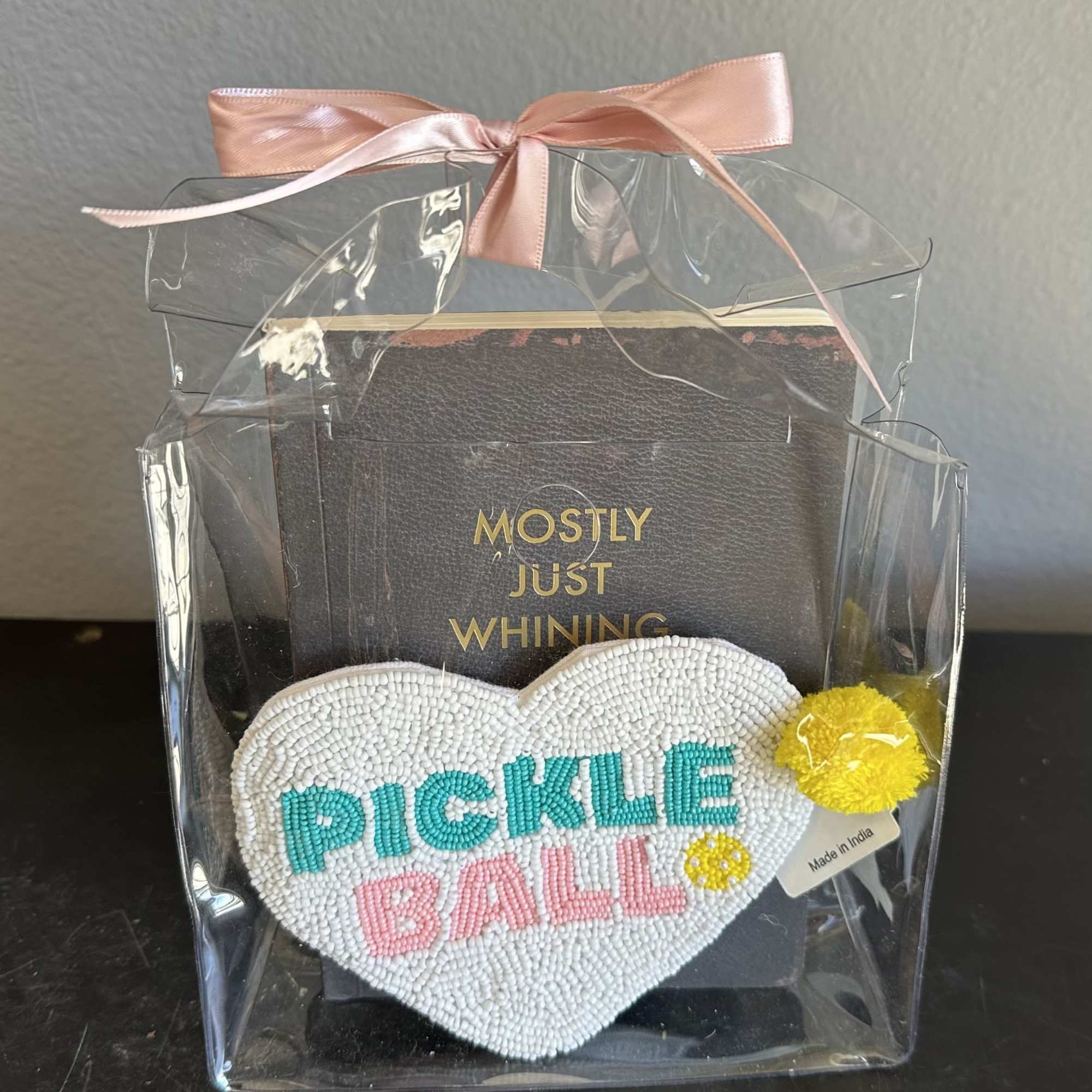 A cute bedazzled sequined pickleball change purse with a &quot;just whining&quot; notebook