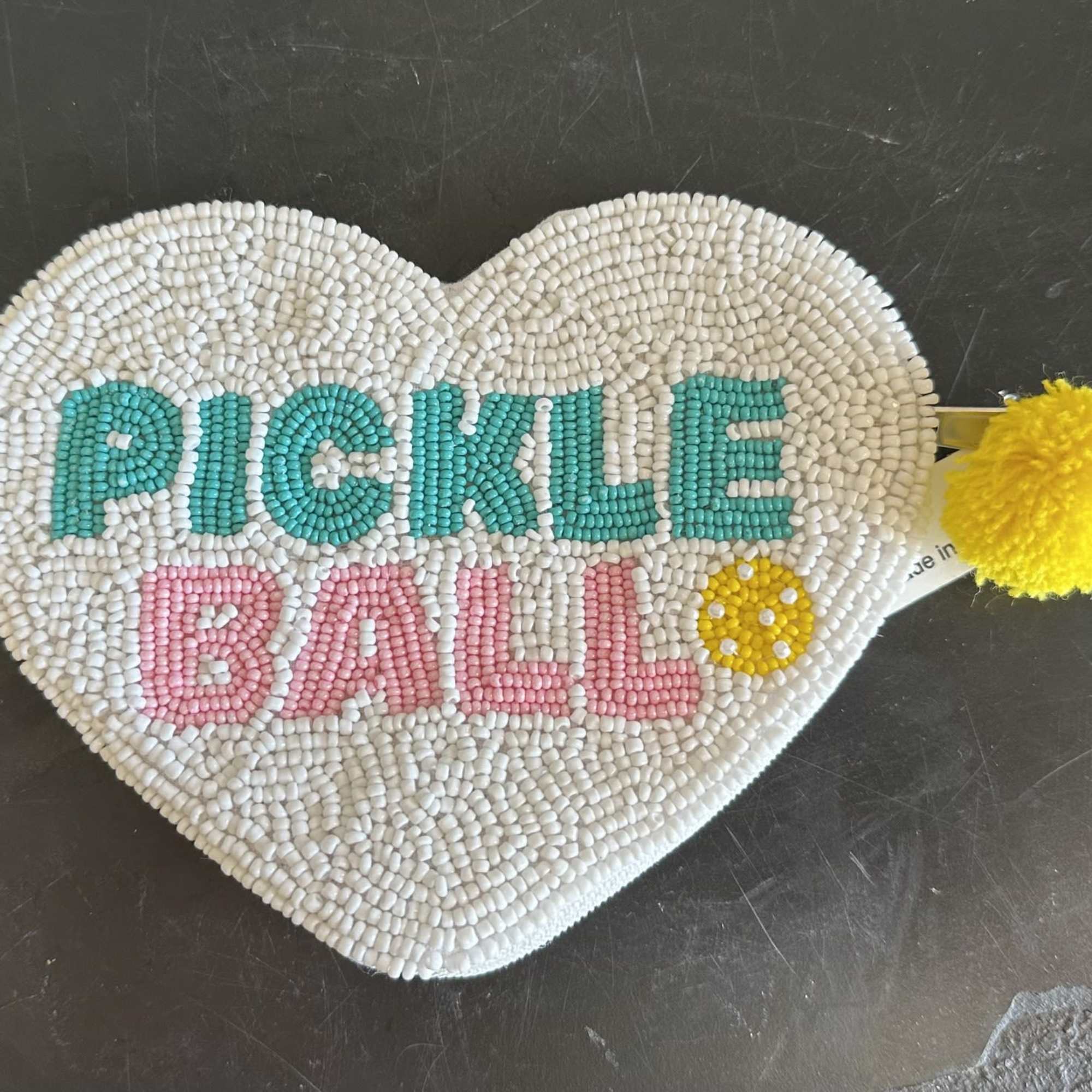 A cute bedazzled sequined pickleball change purse with a &quot;just whining&quot; notebook