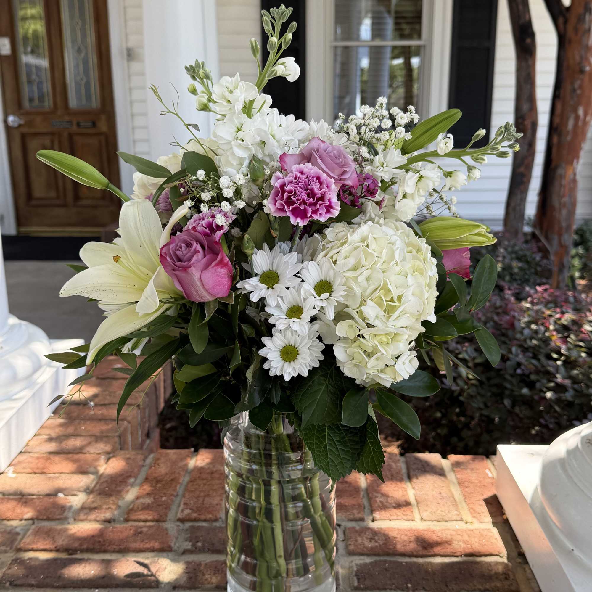 A tender expression of care, this soft and timeless arrangement is designed