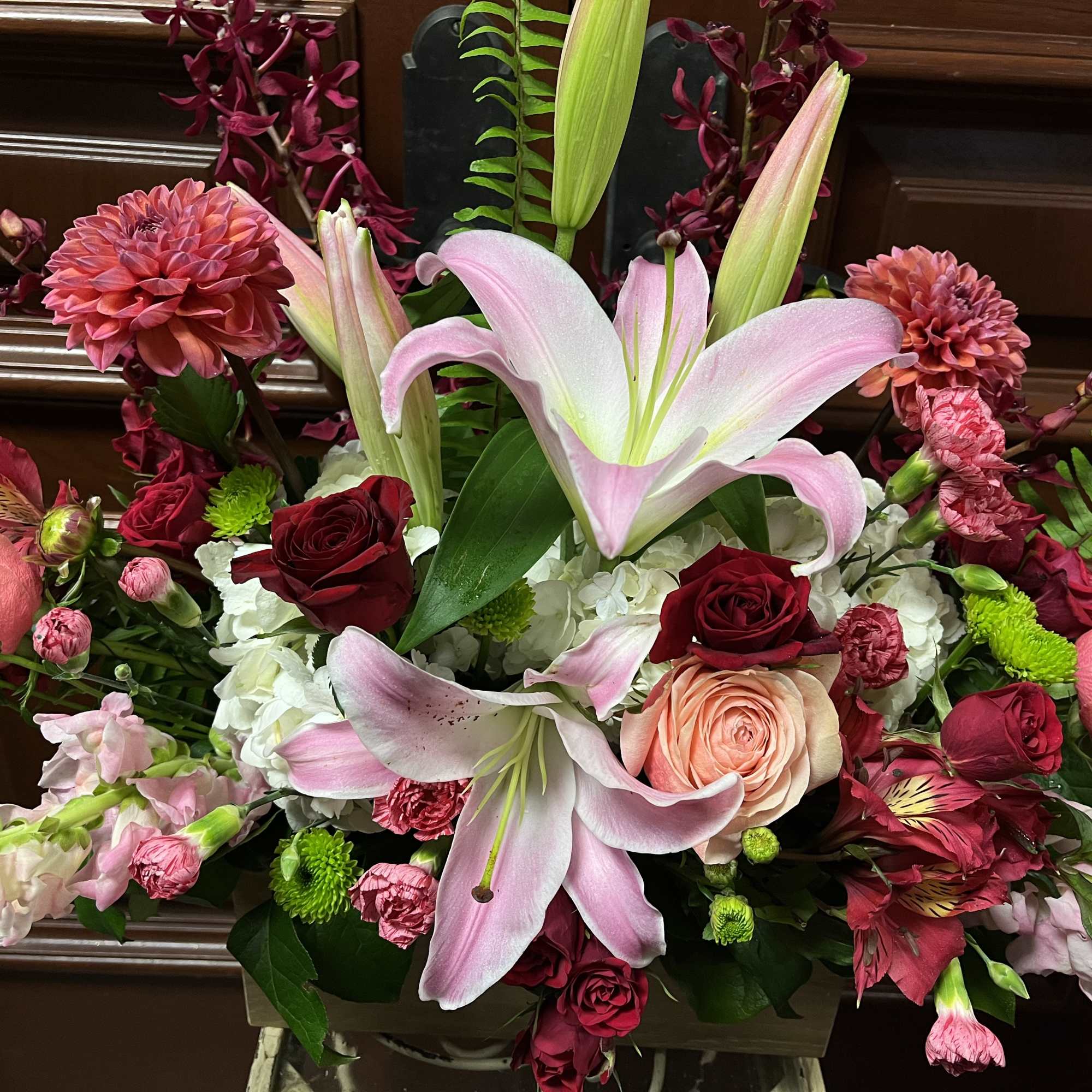 Recipe: Seasonal Dahlias, Burgendy Orchids, Stargazers, Orange/Pink Roses, Pink Snapdragons, Red Spray