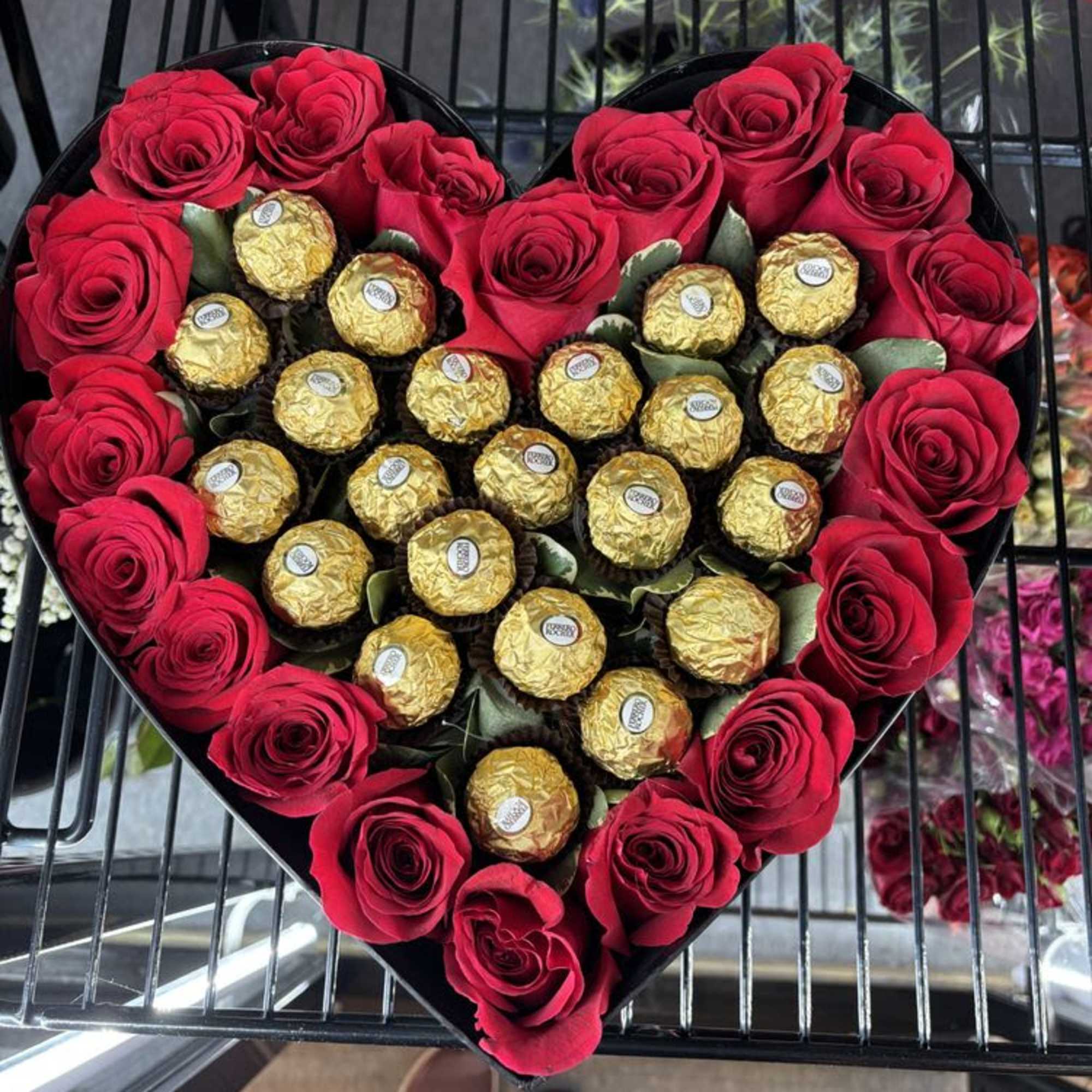 delicious chocolate surrounded by beautiful roses of your choice.