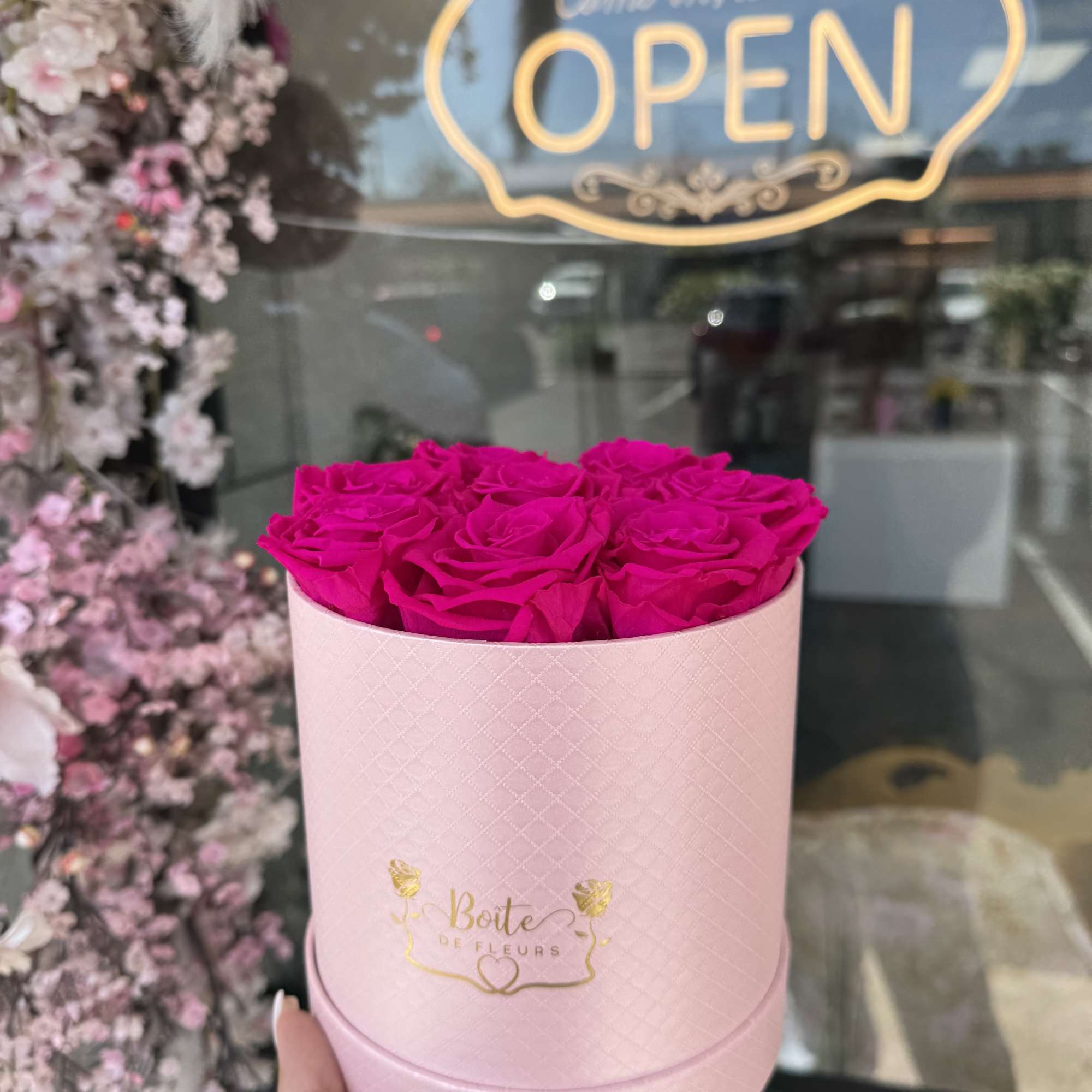 Pink preserved forever roses nestled in a light pink Boîte box.  Pink preserved forever roses nestled in a light pink Boîte box.