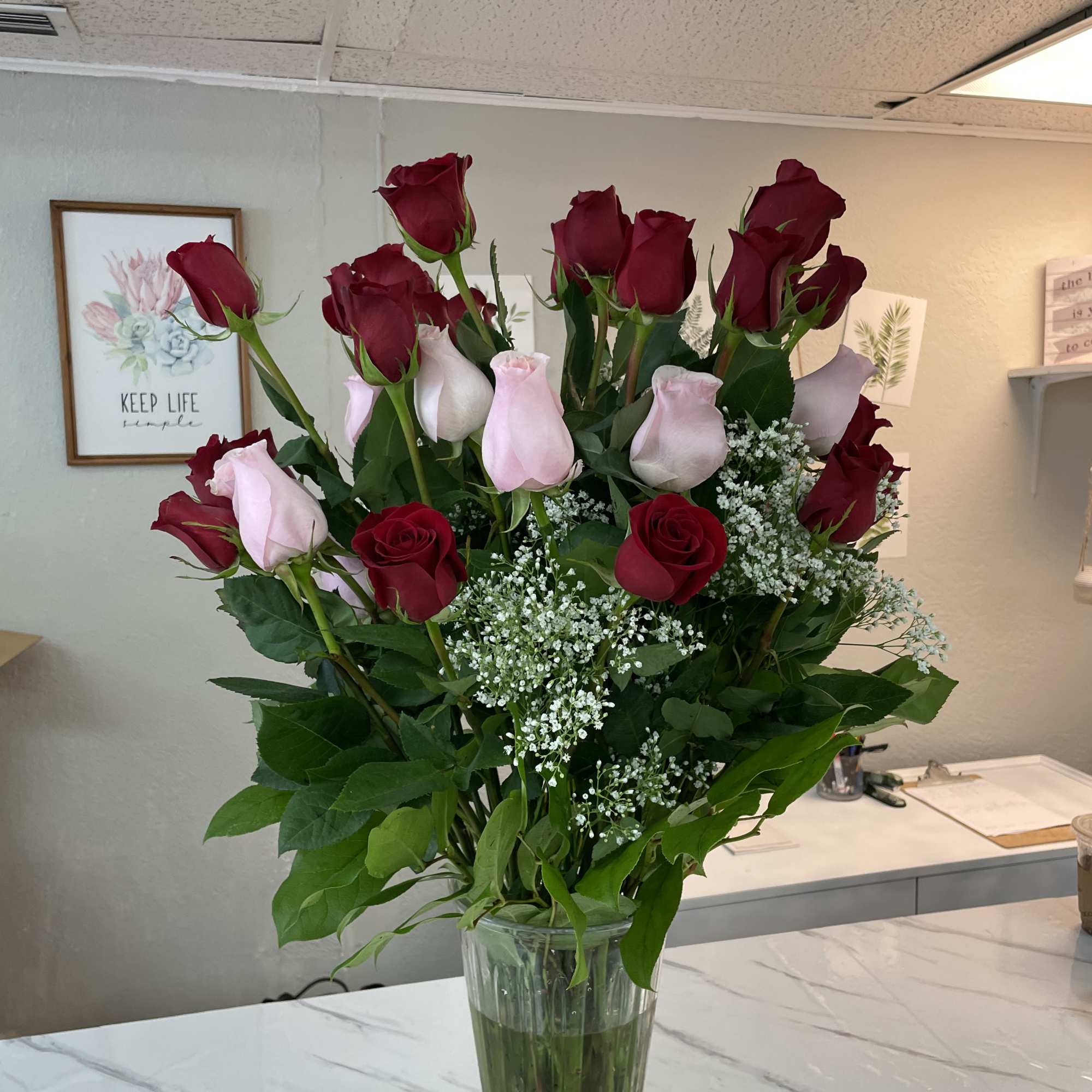 three dozen red roses, white, andpink premium long stem in a vase three dozen red roses, white, andpink premium long stem in a vase