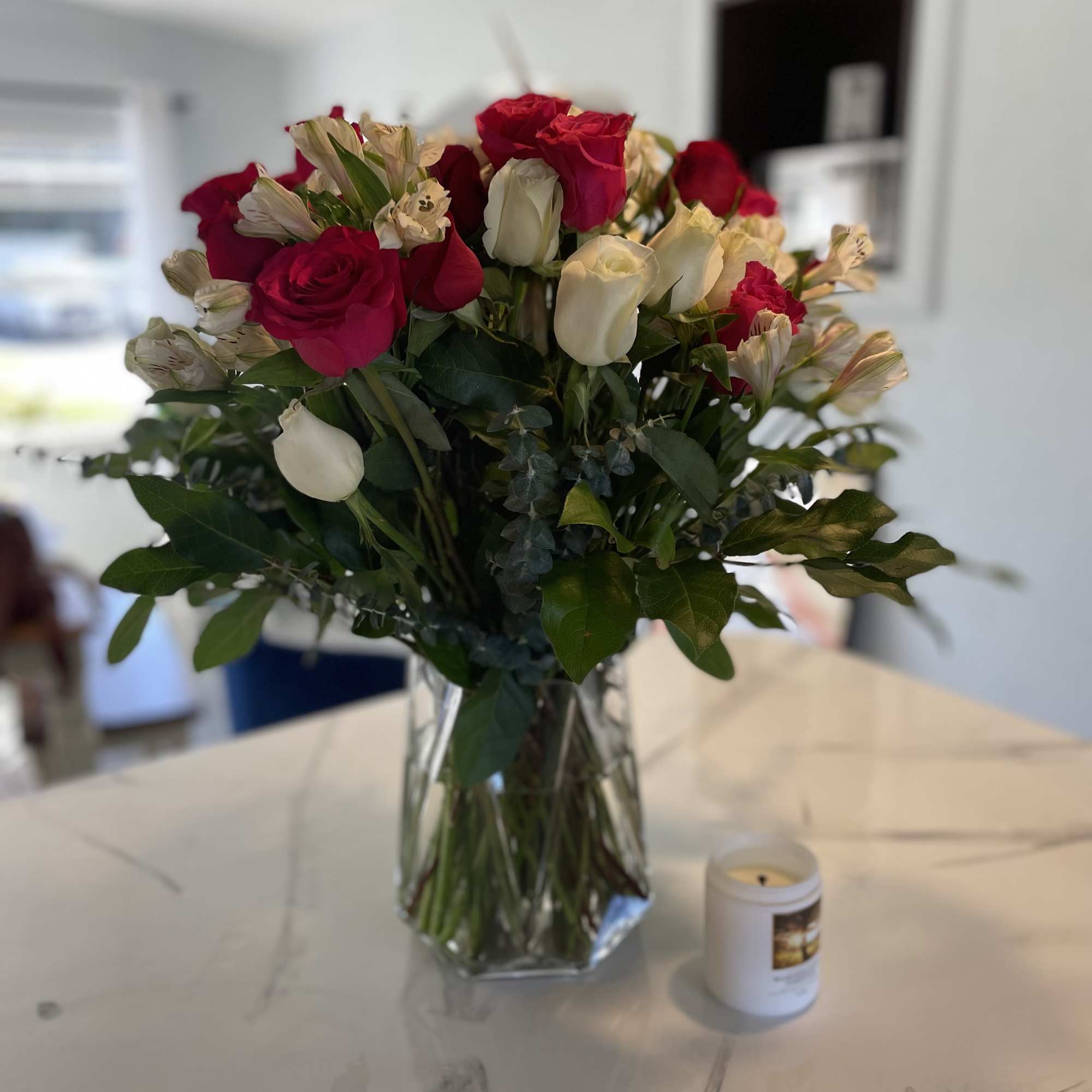 three dozen red roses, white, andpink premium long stem in a vase three dozen red roses, white, andpink premium long stem in a vase