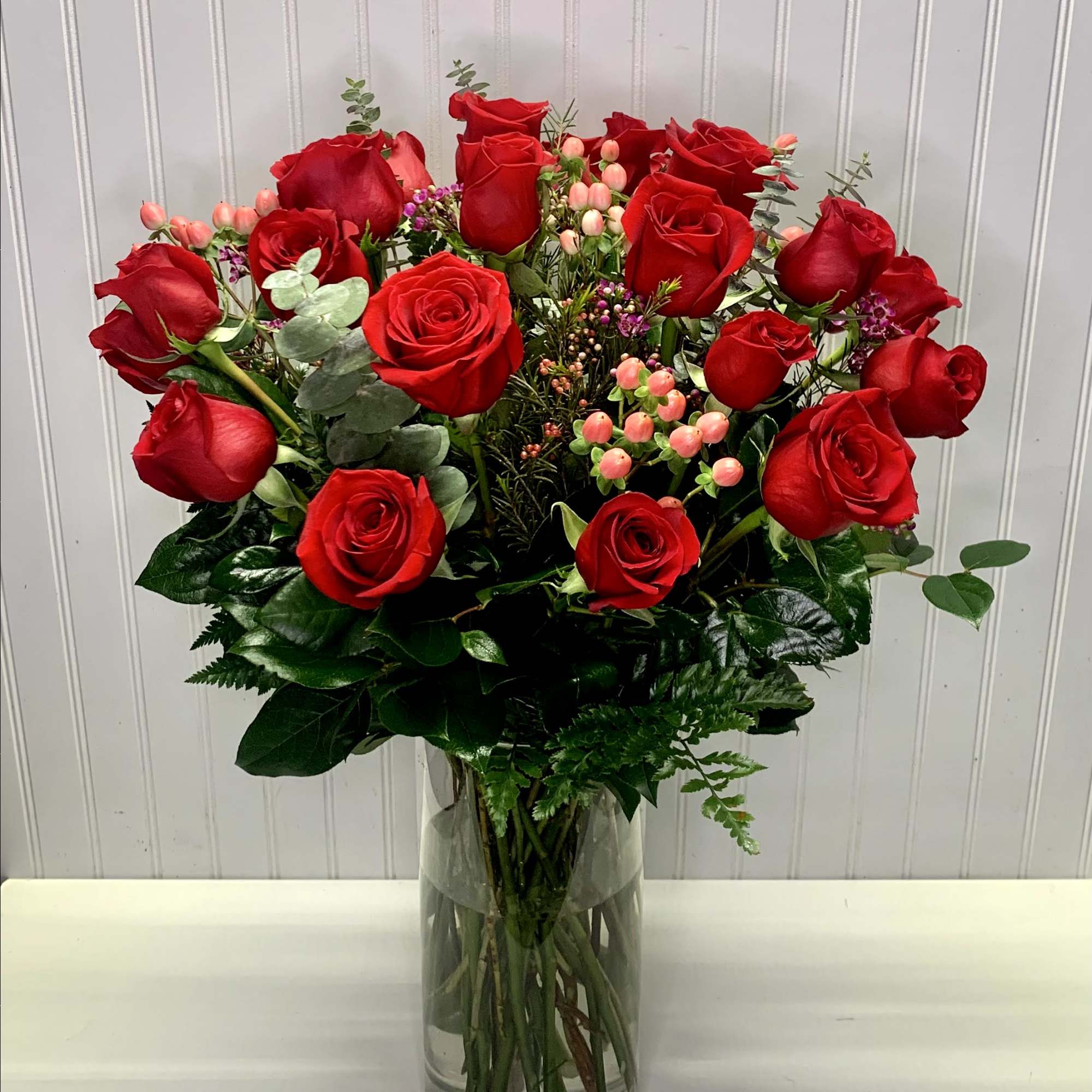A beautiful arrangement with red freedom roses, perfec for that special person