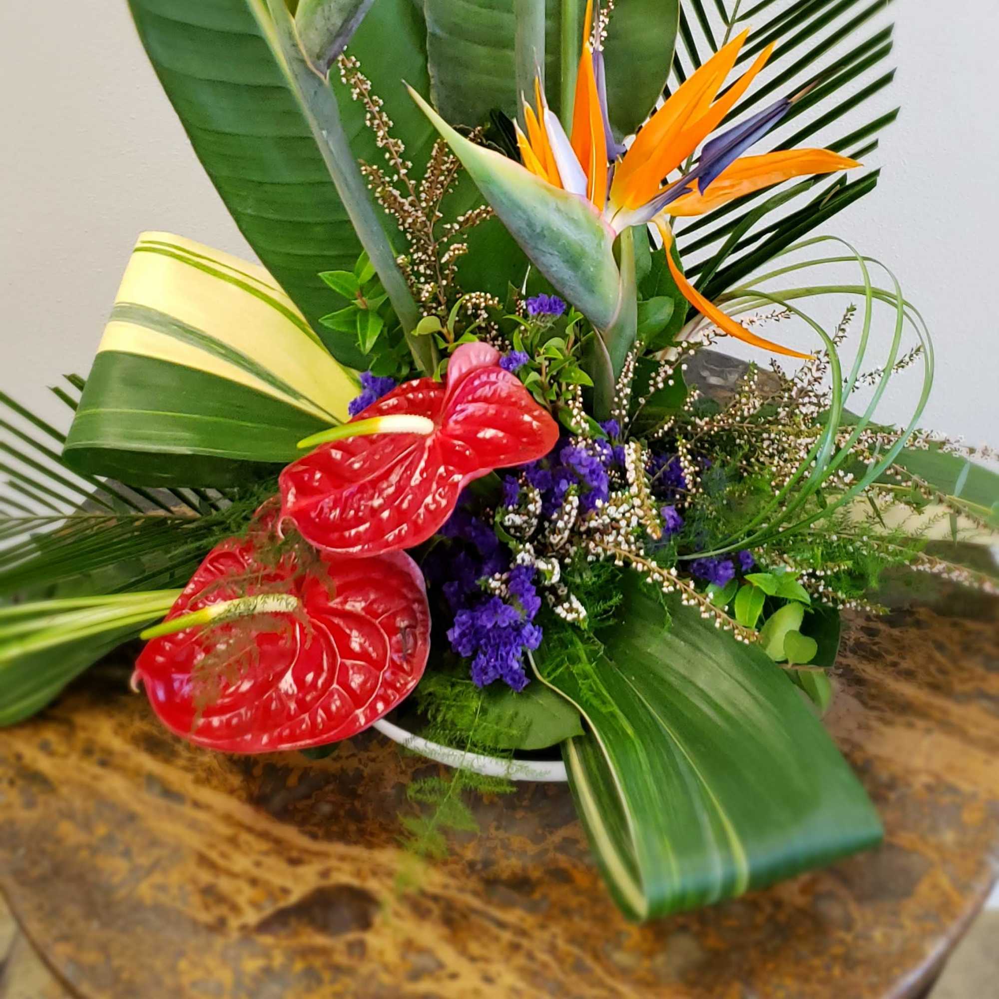 Pull them into paradise with a flower bouquet of tropical blooms that Pull them into paradise with a flower bouquet of tropical blooms that