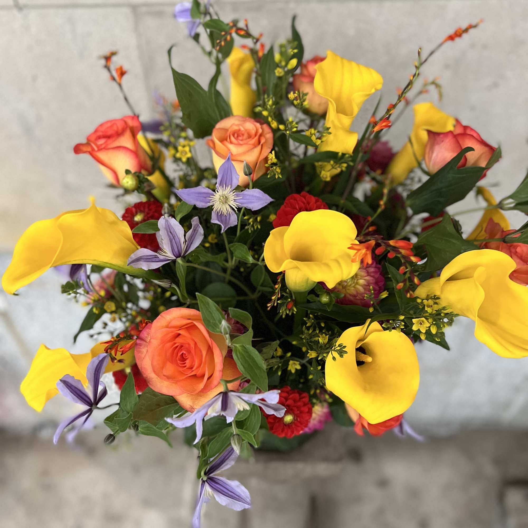 Medium to tall composition assortment of yellow captain calla lily's, yellow lysimachia Medium to tall composition assortment of yellow captain calla lily's, yellow lysimachia