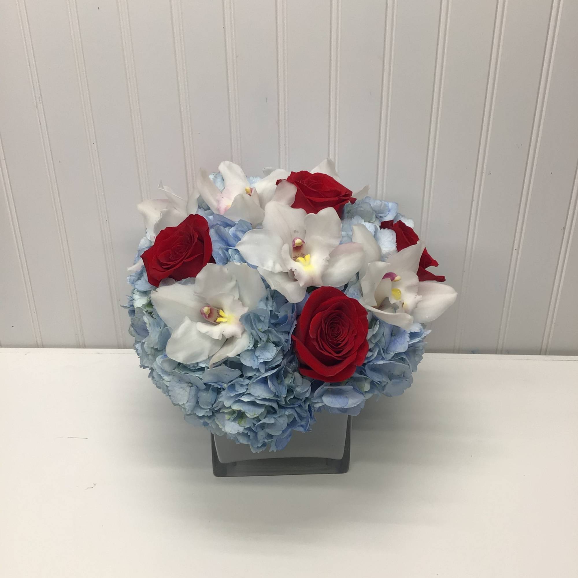 Lovely reds and blues with white come together in this romantic gift