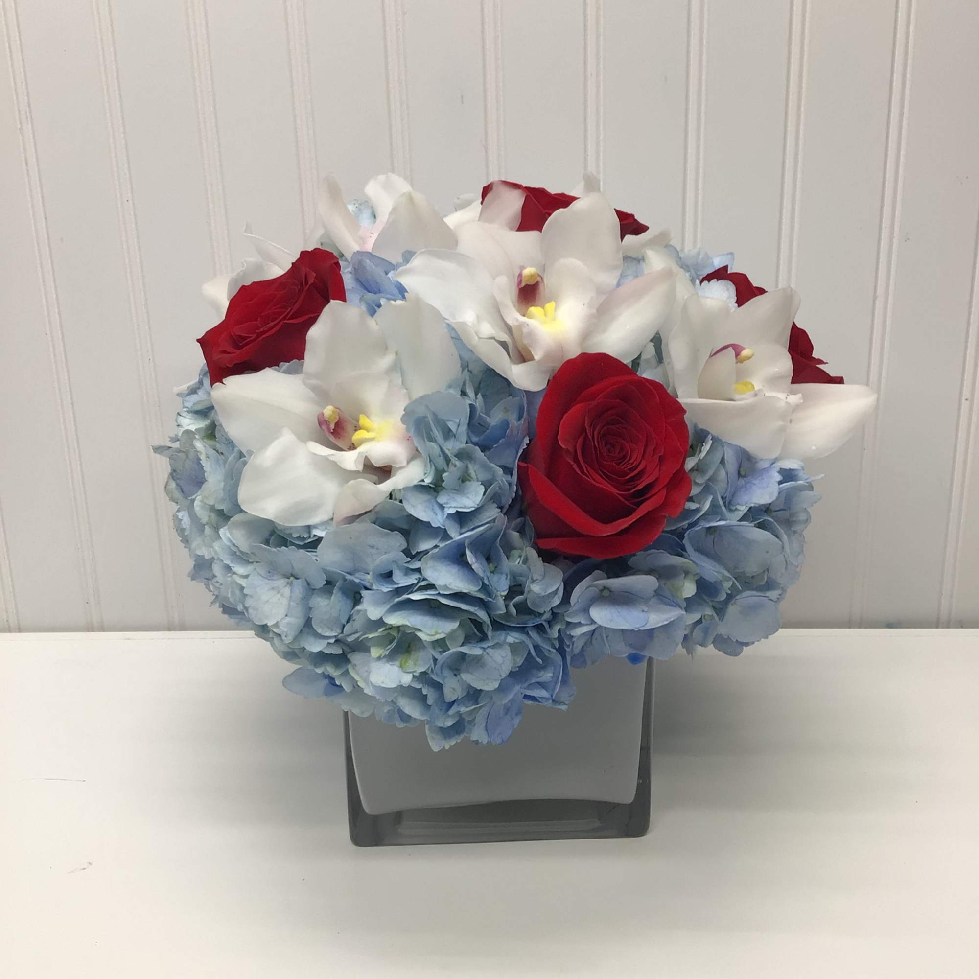 Lovely reds and blues with white come together in this romantic gift