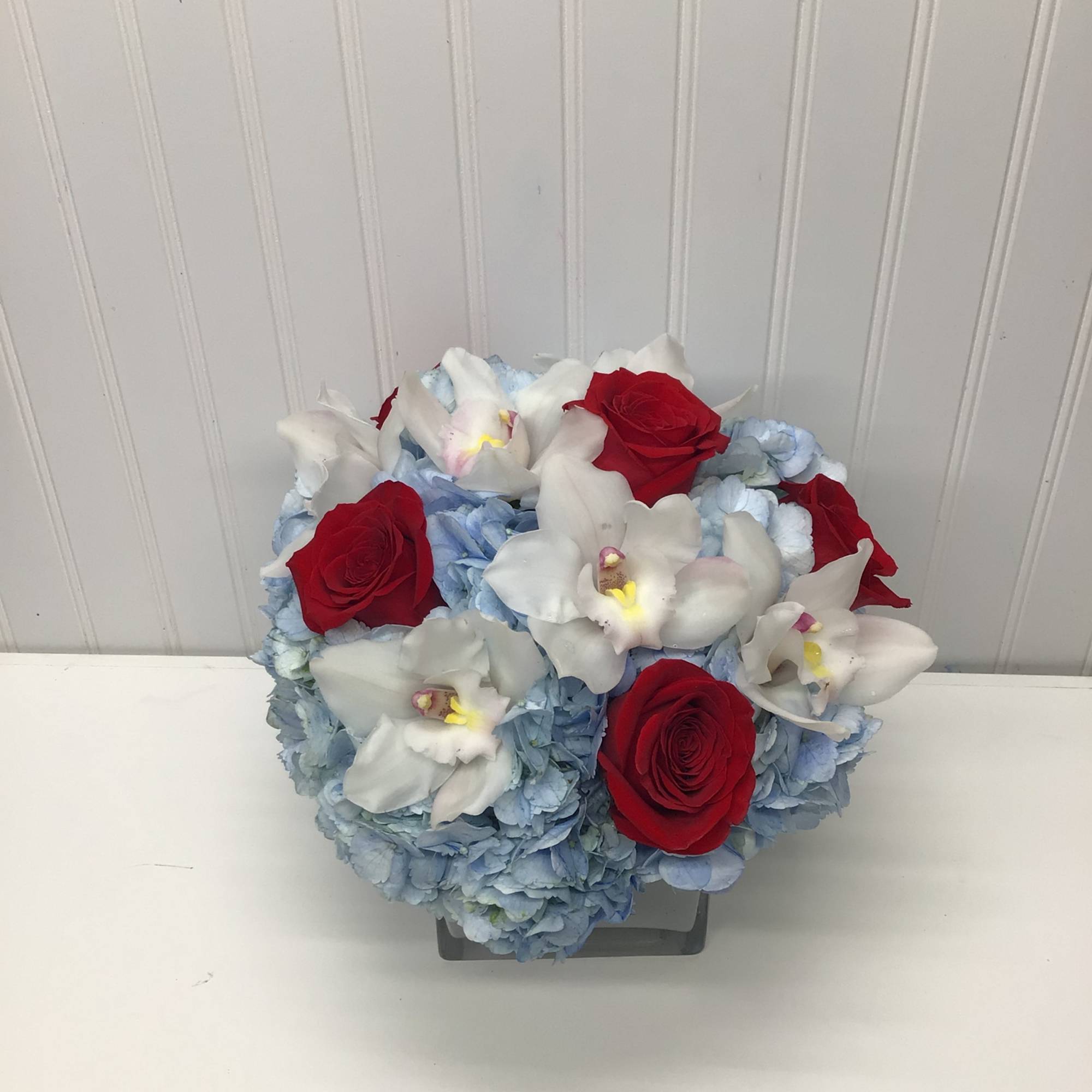 Lovely reds and blues with white come together in this romantic gift