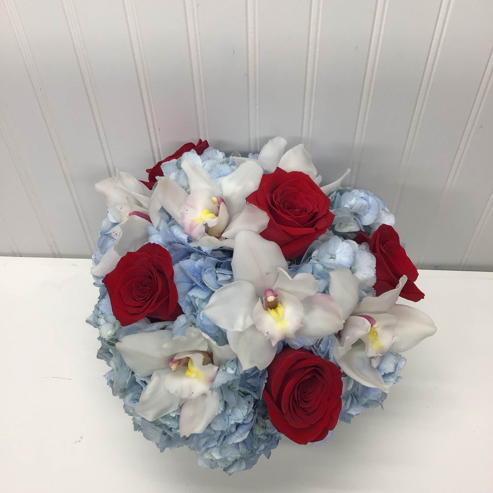 Lovely reds and blues with white come together in this romantic gift
