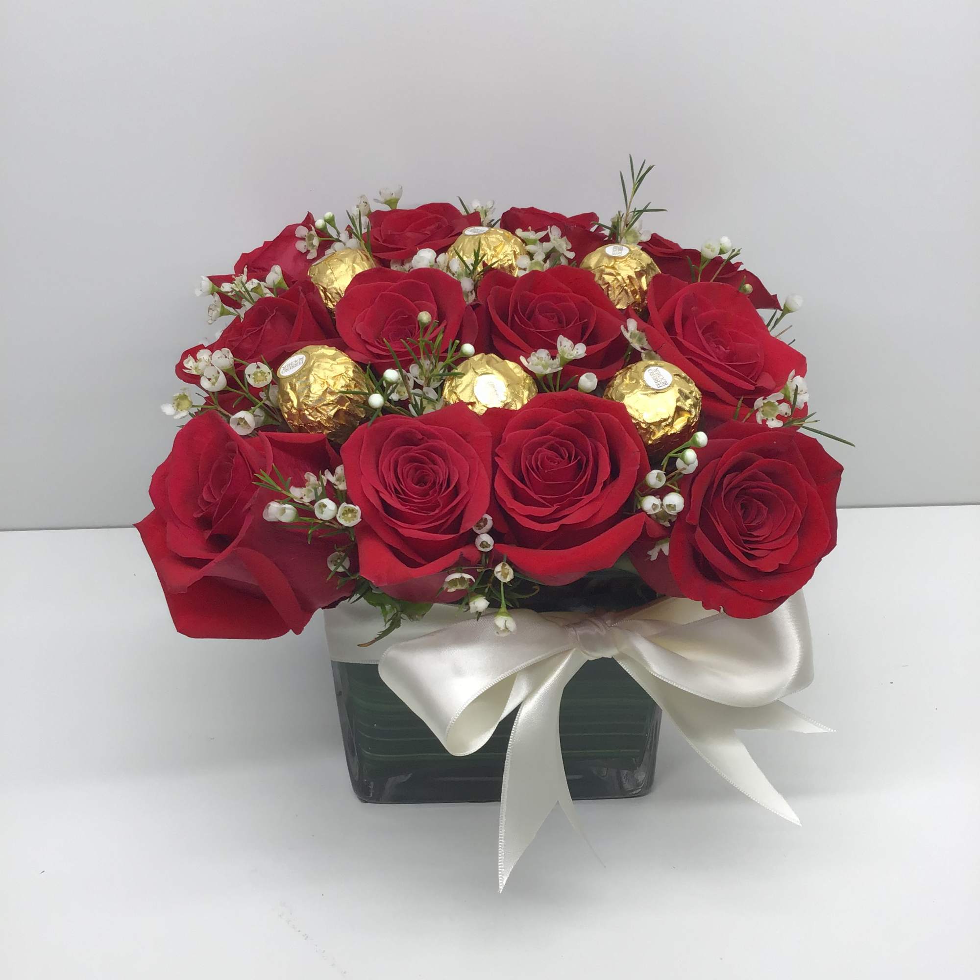 A beautiful arrangement with red roses and Ferrero chocolates 