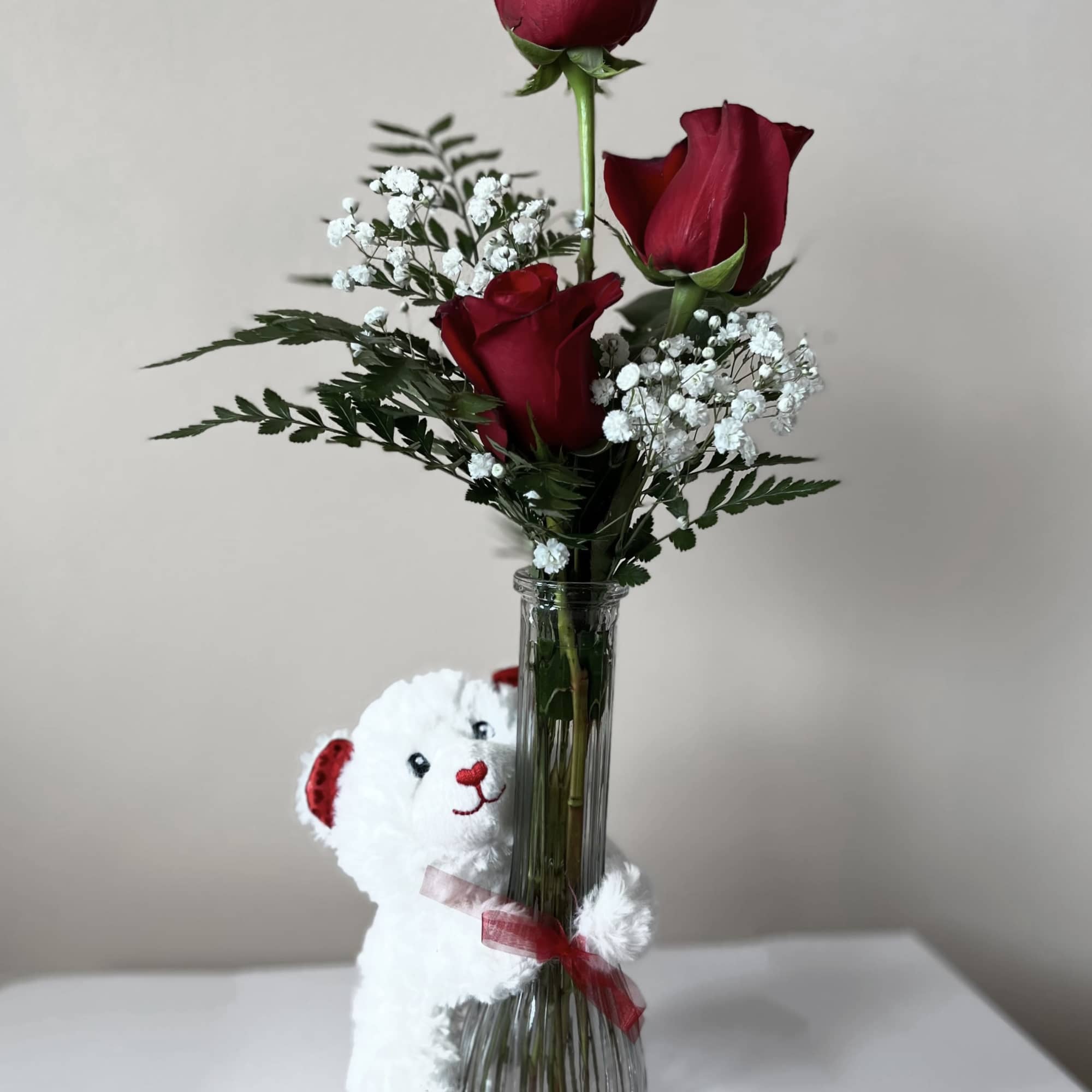 Embrace your feelings with a classic gift of long-stem red roses. Displayed