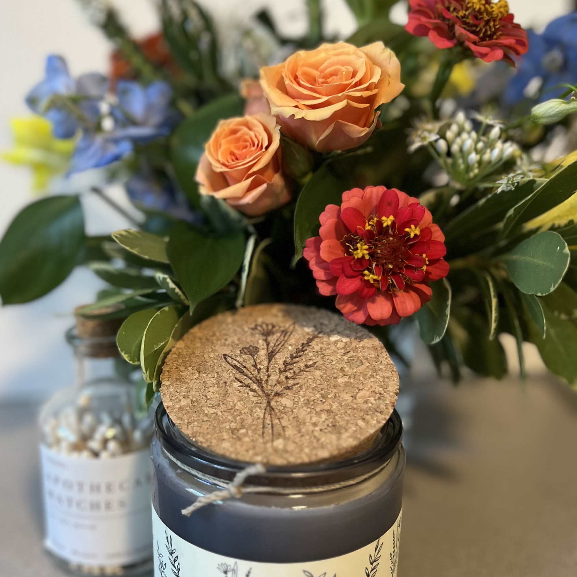 1 Fall candle from Aster &amp; co
1 Petite Designers Choice Arrangement
1 Apothecary