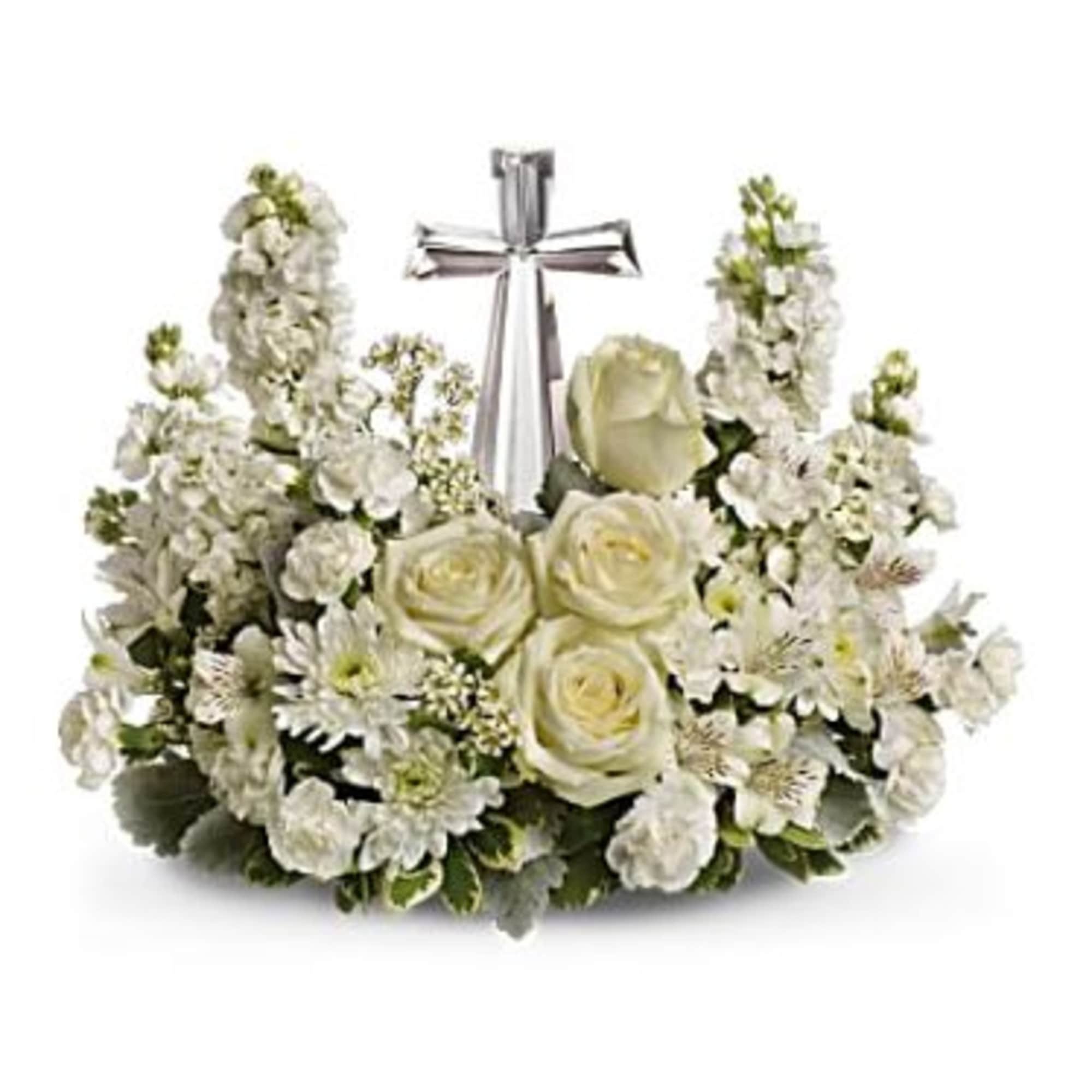 A keepsake crystal cross is framed by a collection of mixed all A keepsake crystal cross is framed by a collection of mixed all
