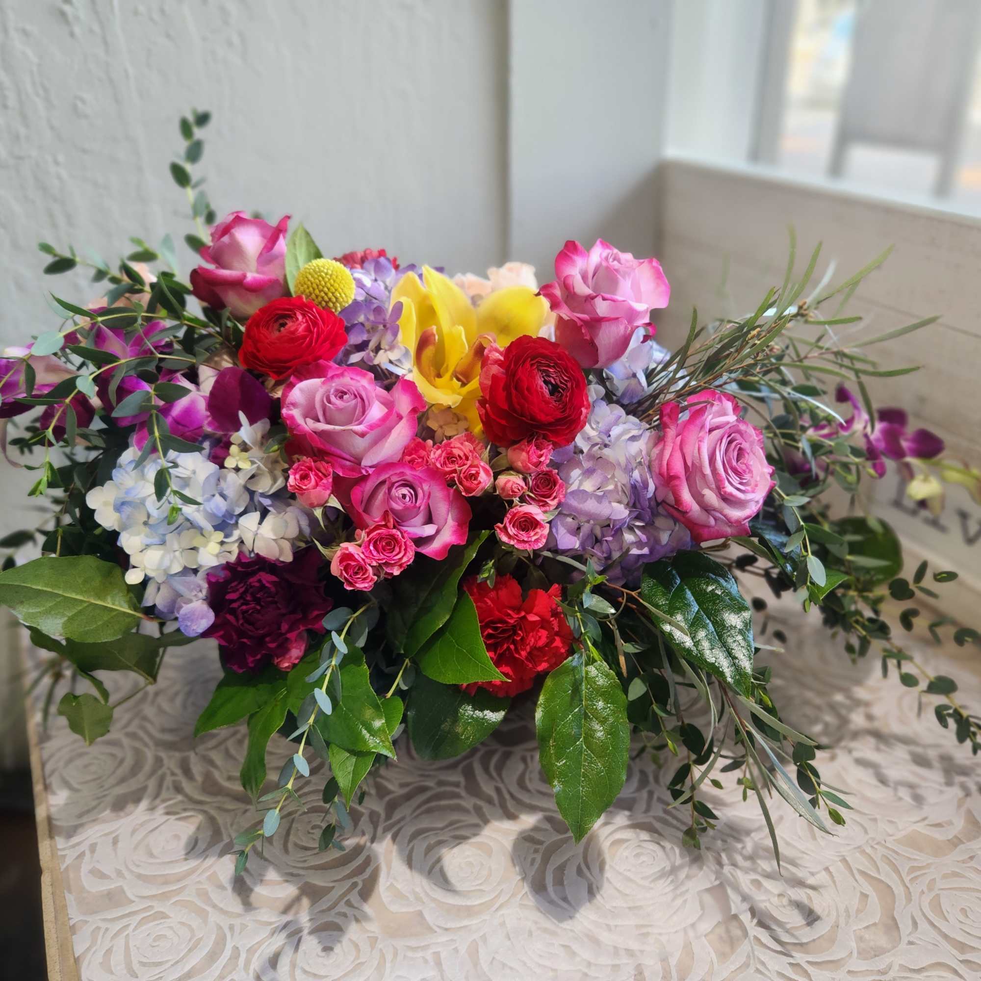 A color beautiful arrangement in a vase or container. 