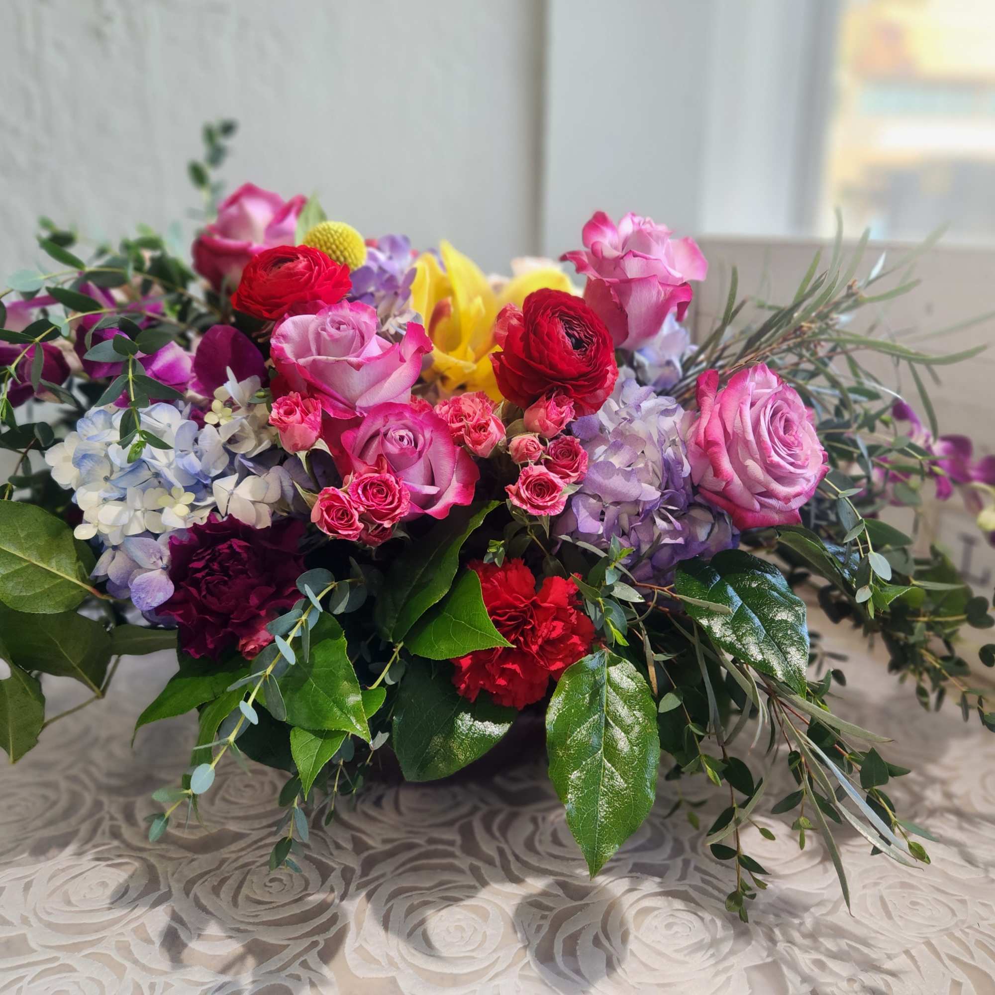 A color beautiful arrangement in a vase or container. 