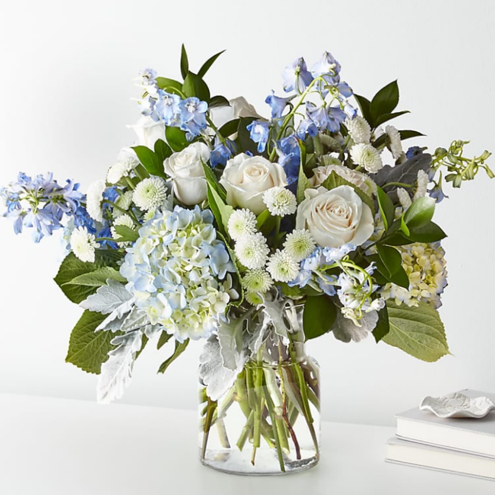 FTD design, let this uplifting arrangement be reminders of the clear skies