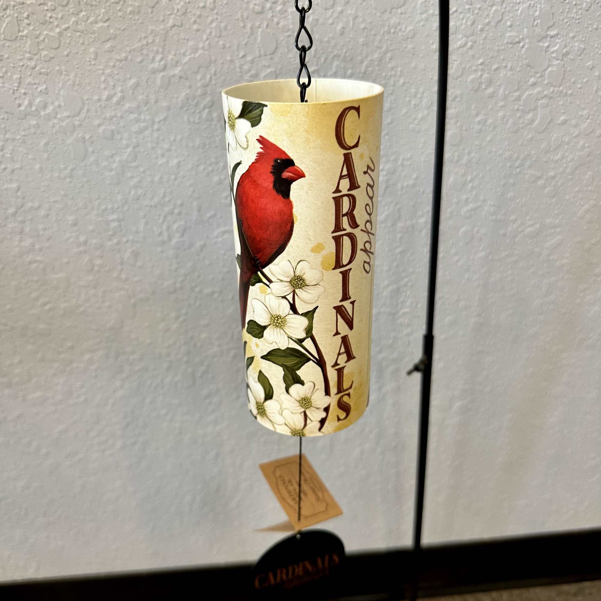 A super cool small cylinder tube metal wind chime, that has a