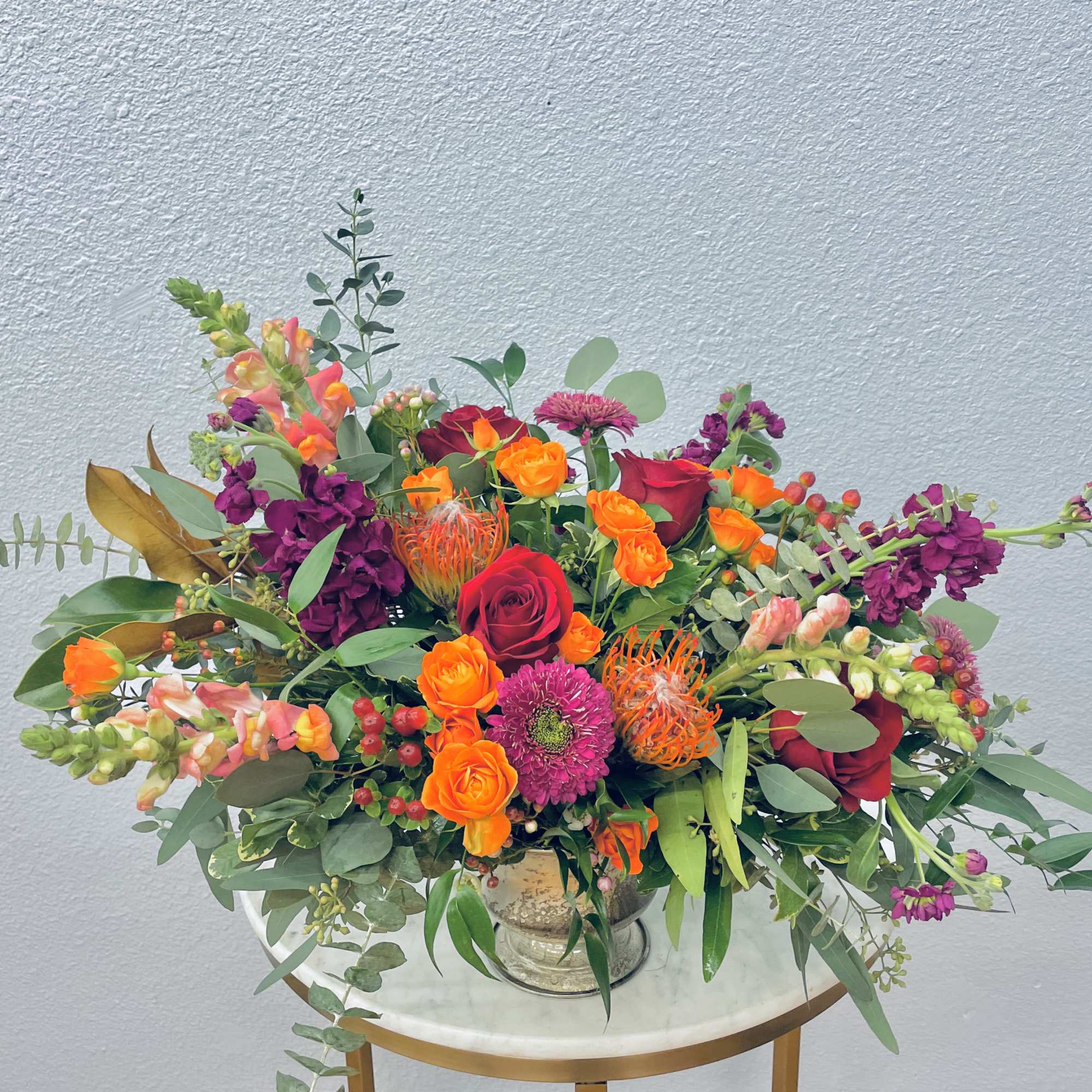 Color Palette: orange, red, purple, pink, green
Warm orange, red and burgundy pin