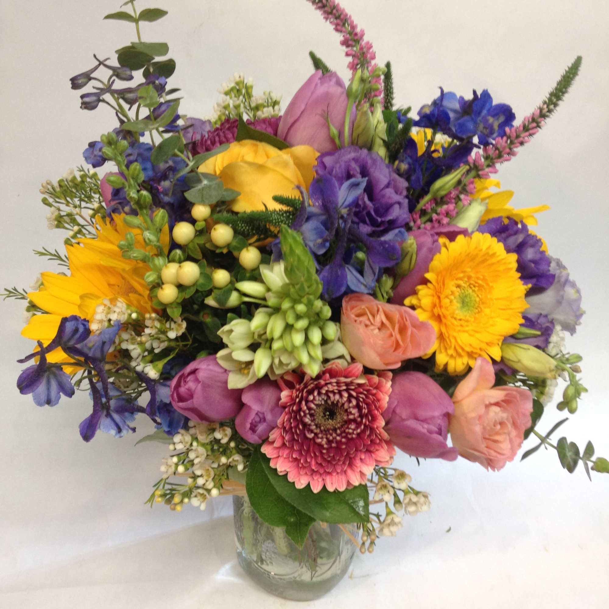 This bright and cheerful arrangement captures the carefree spirit of summer in