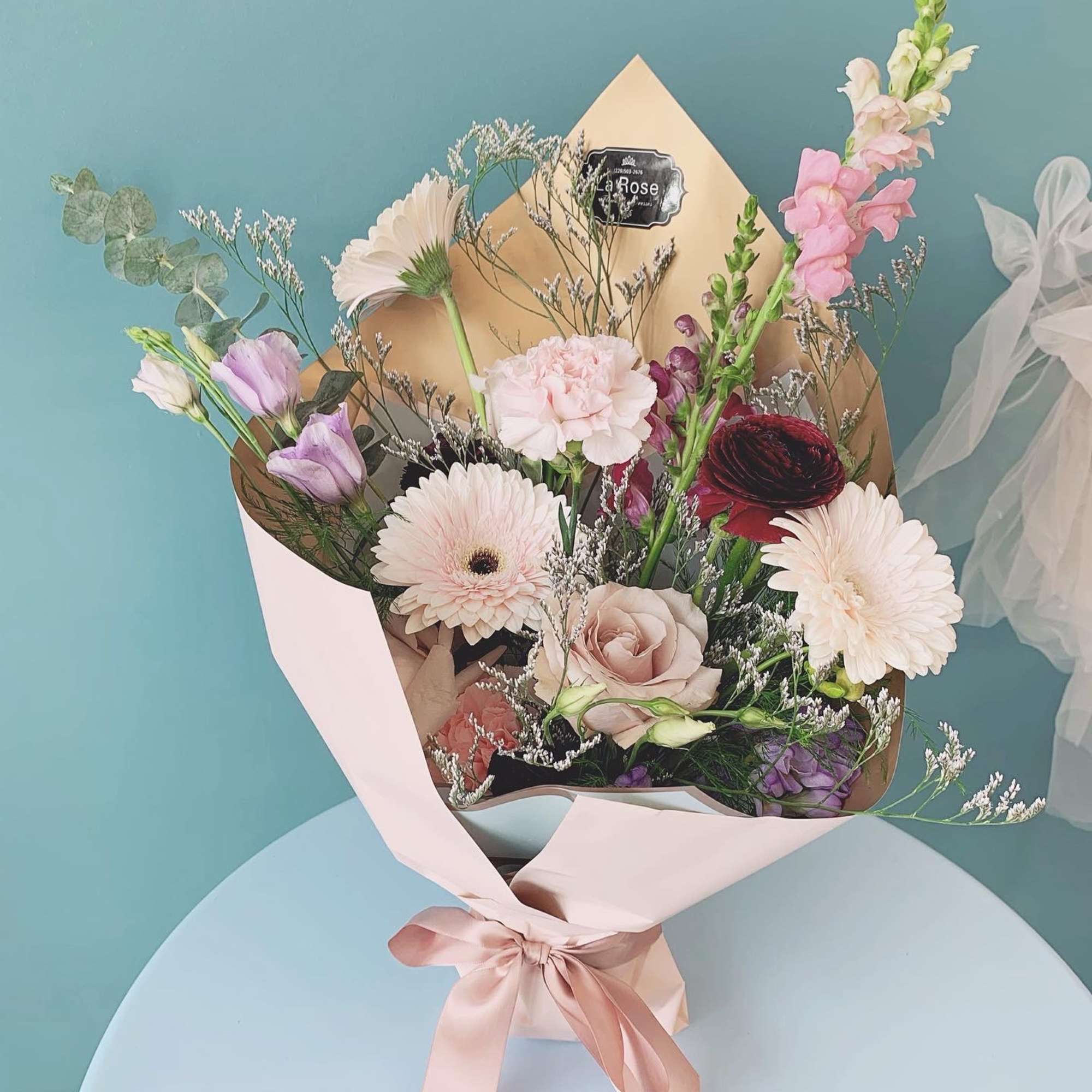 Elevate any occasion with our premium seasonal fresh blooms, artfully arranged with