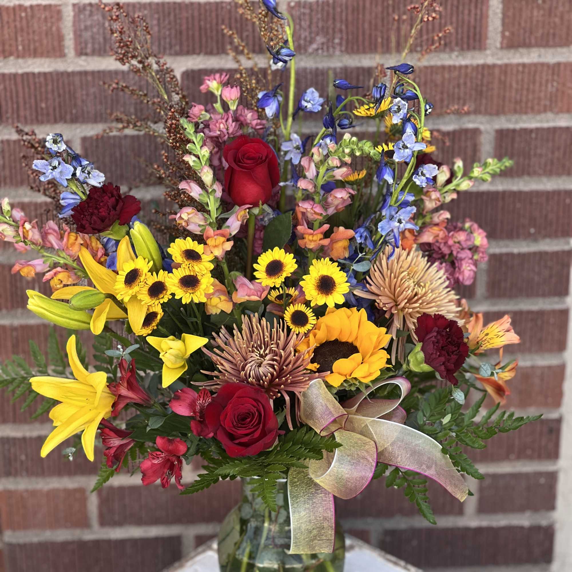 All the colors of fall in a large, full arrangement is sure All the colors of fall in a large, full arrangement is sure