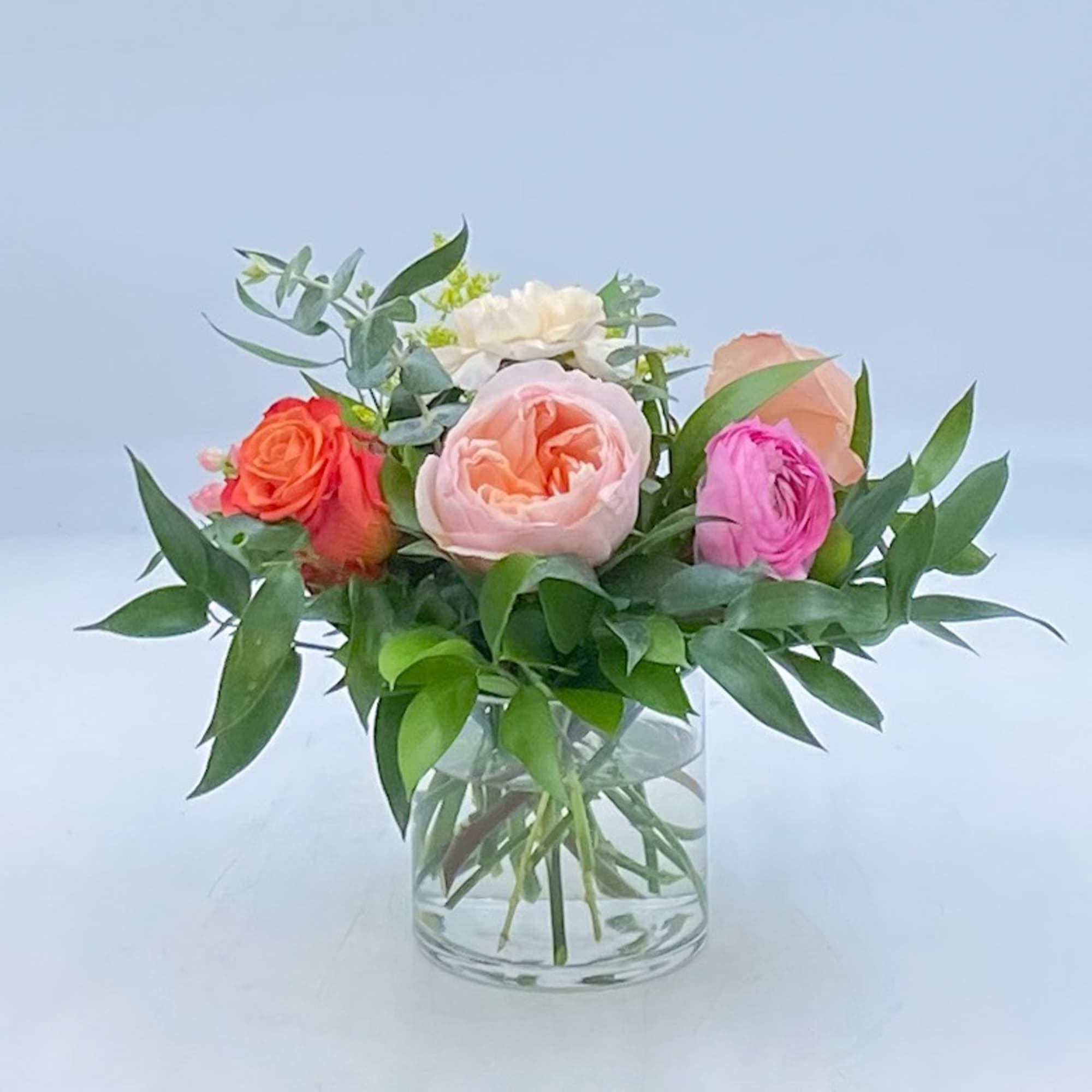 Petite Paloma is arranged with a Juliet Garden Rose, a Shimmer Rose