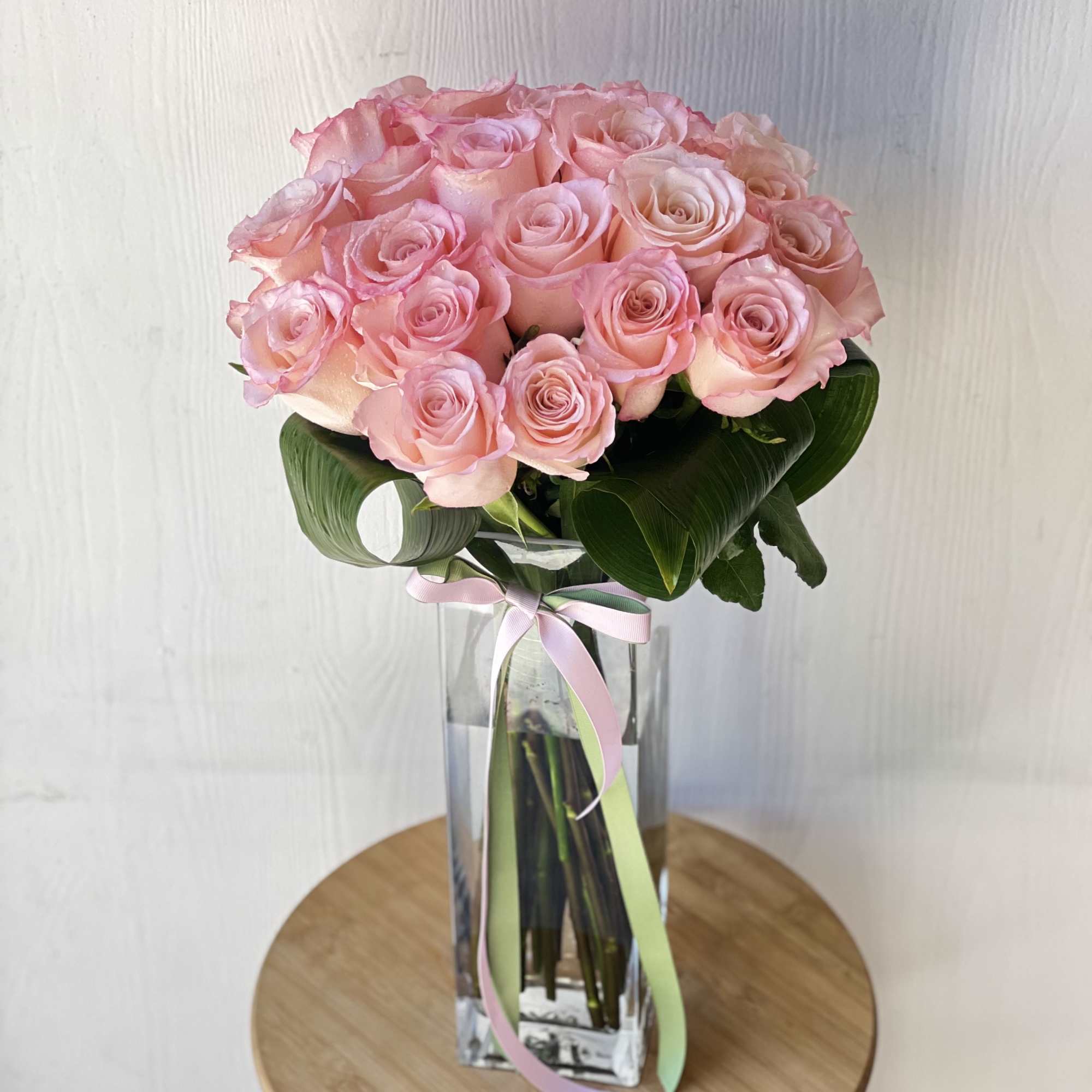 Introducing our exquisite creation that includes two dozen(strandard) pink long stem roses