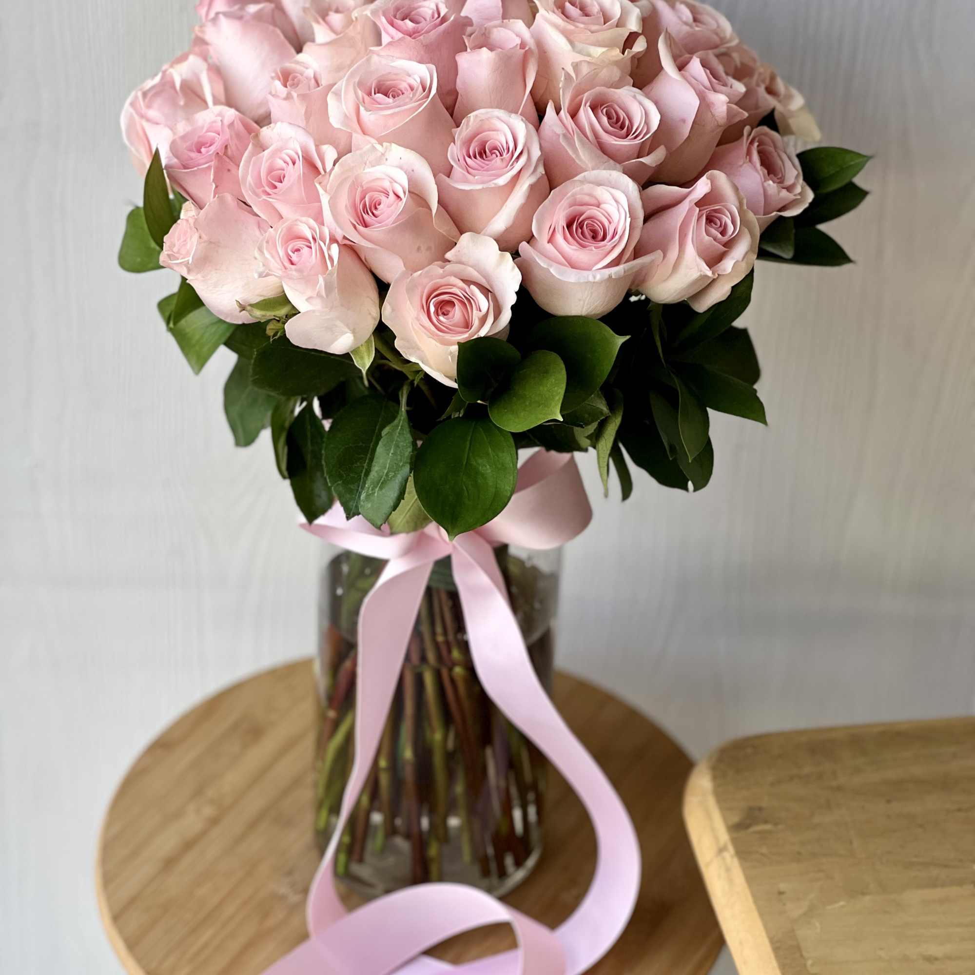 Introducing our exquisite creation that includes two dozen(strandard) pink long stem roses