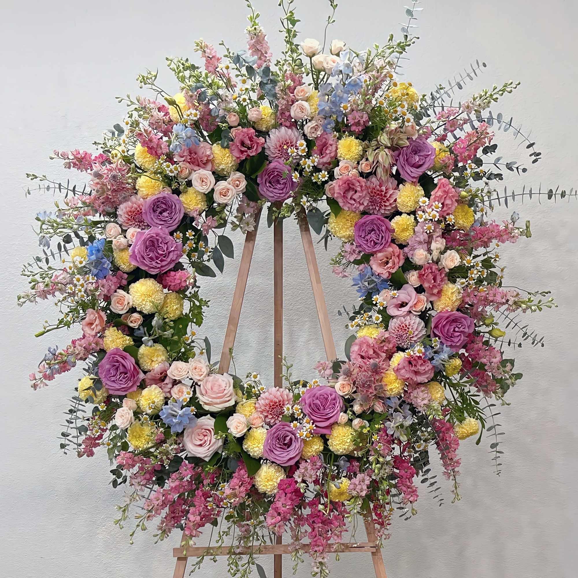 Wreaths are traditional symbols of eternal life. Our designs are abundantly filled