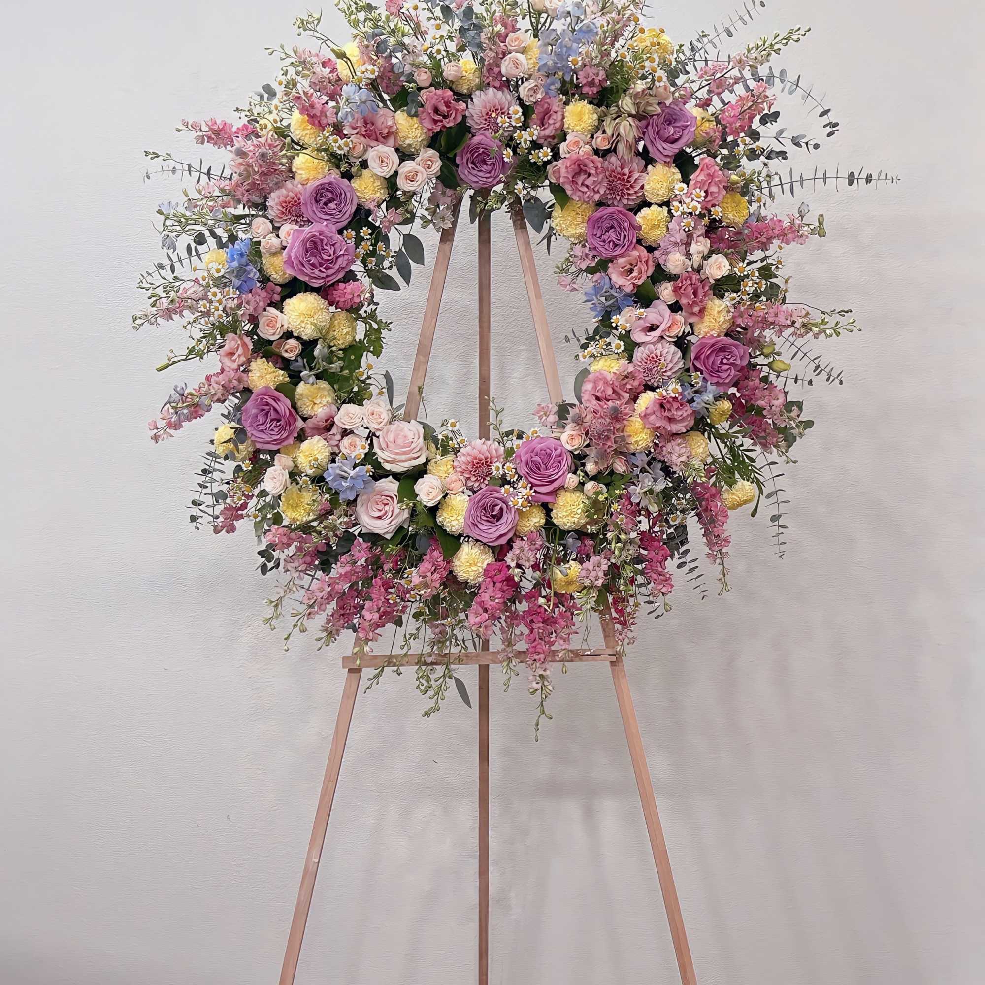 Wreaths are traditional symbols of eternal life. Our designs are abundantly filled