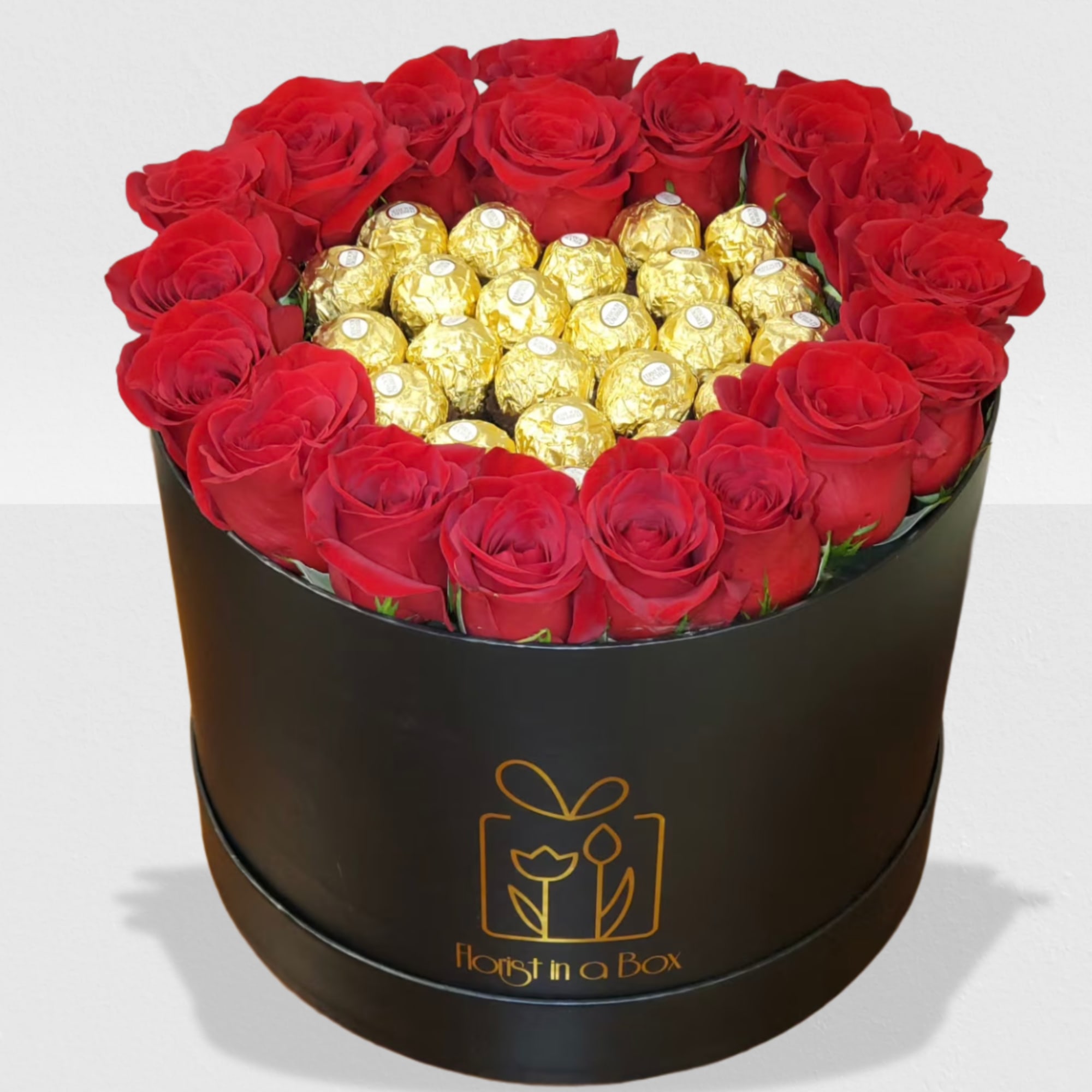 Heart of chocolates surrounded by roses in a box 
NOTICE BOX MAY