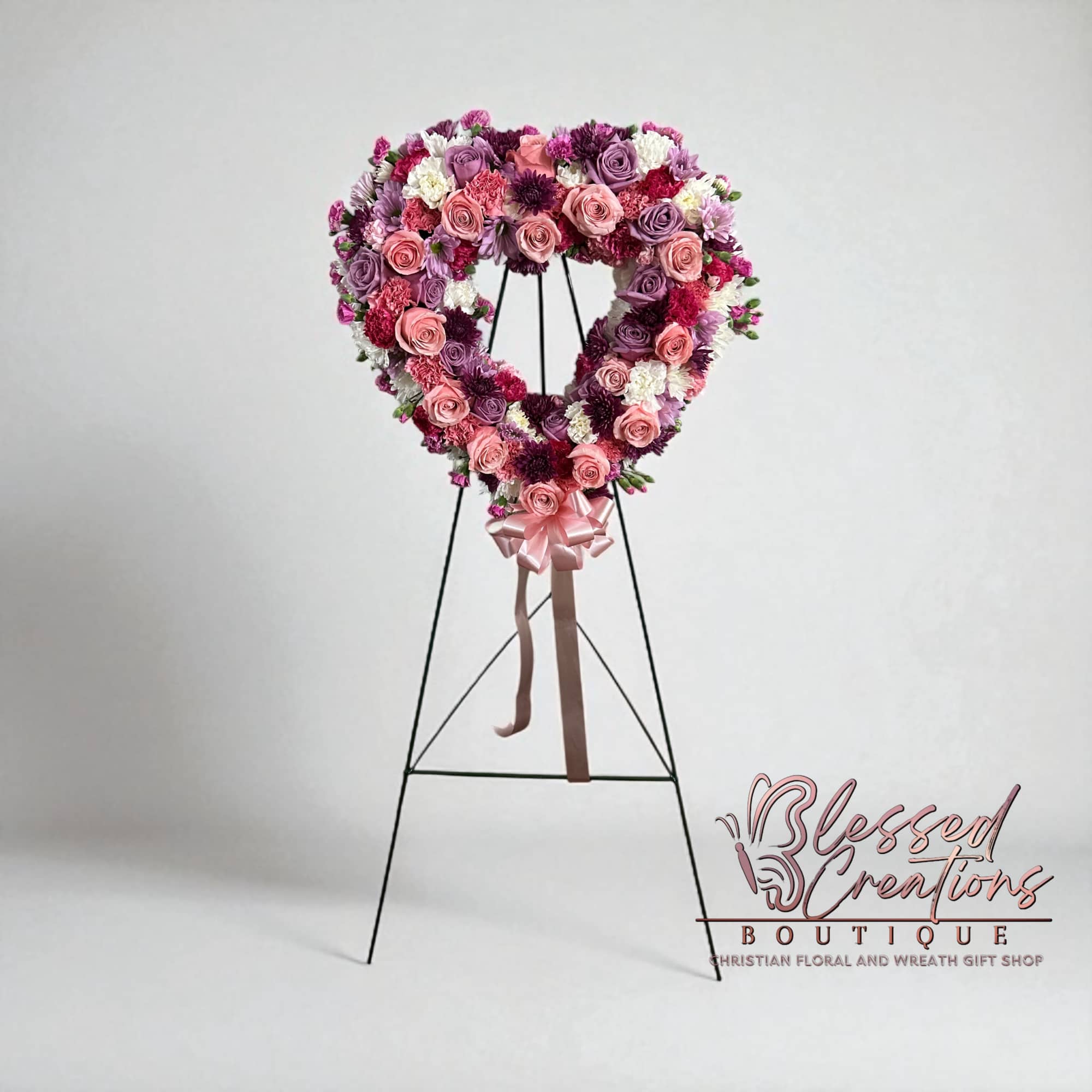 A beautiful tribute of love and remembrance. This heart-shaped wreath is designed
