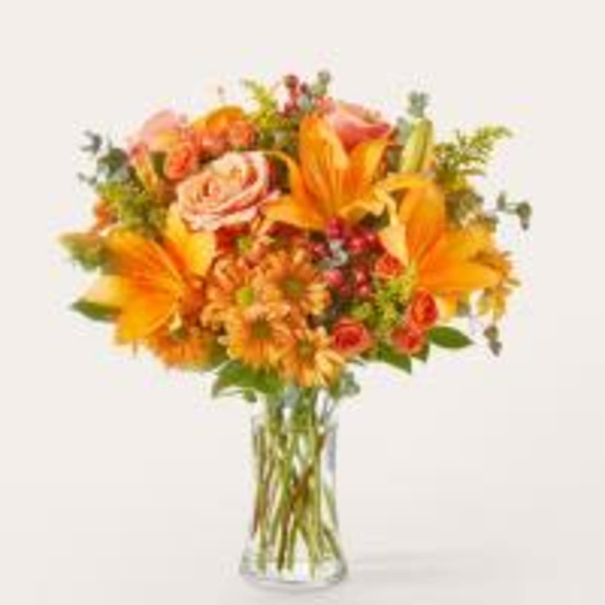 Spark joy with the colors of fall in this warm arrangement, a