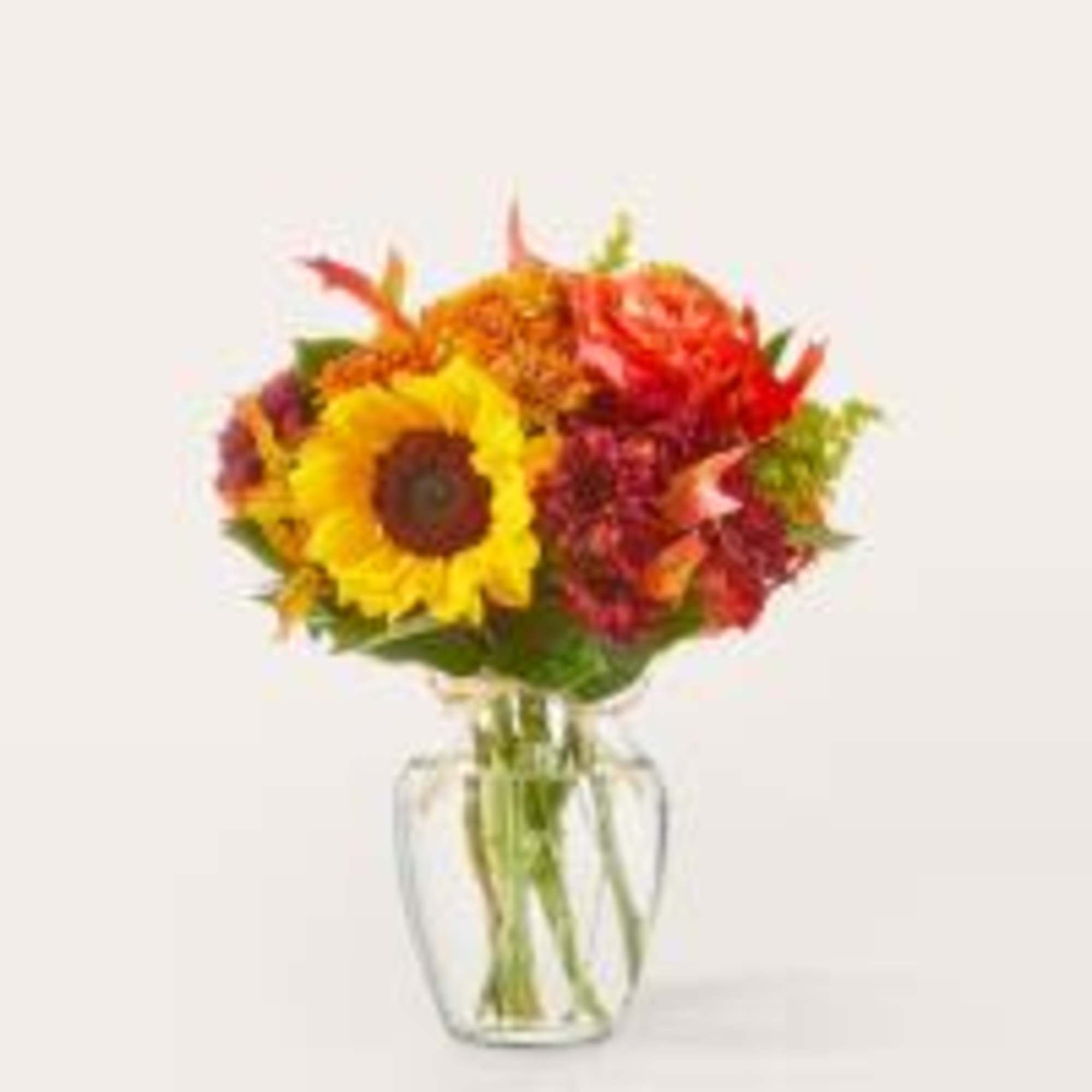 These sunny sunflowers mixed with contrasting blooms makes a beautiful, seasonal way