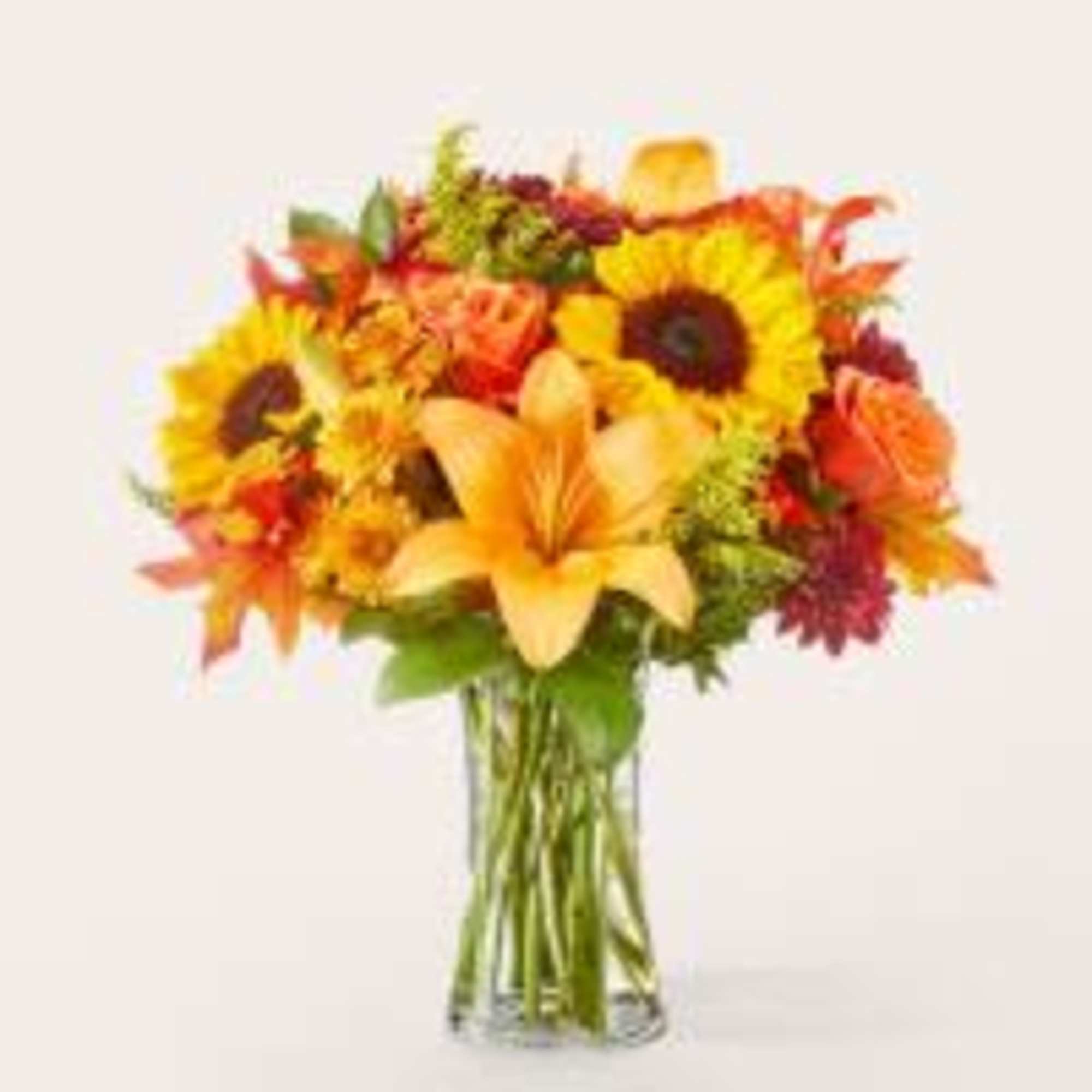 These sunny sunflowers mixed with contrasting blooms makes a beautiful, seasonal way