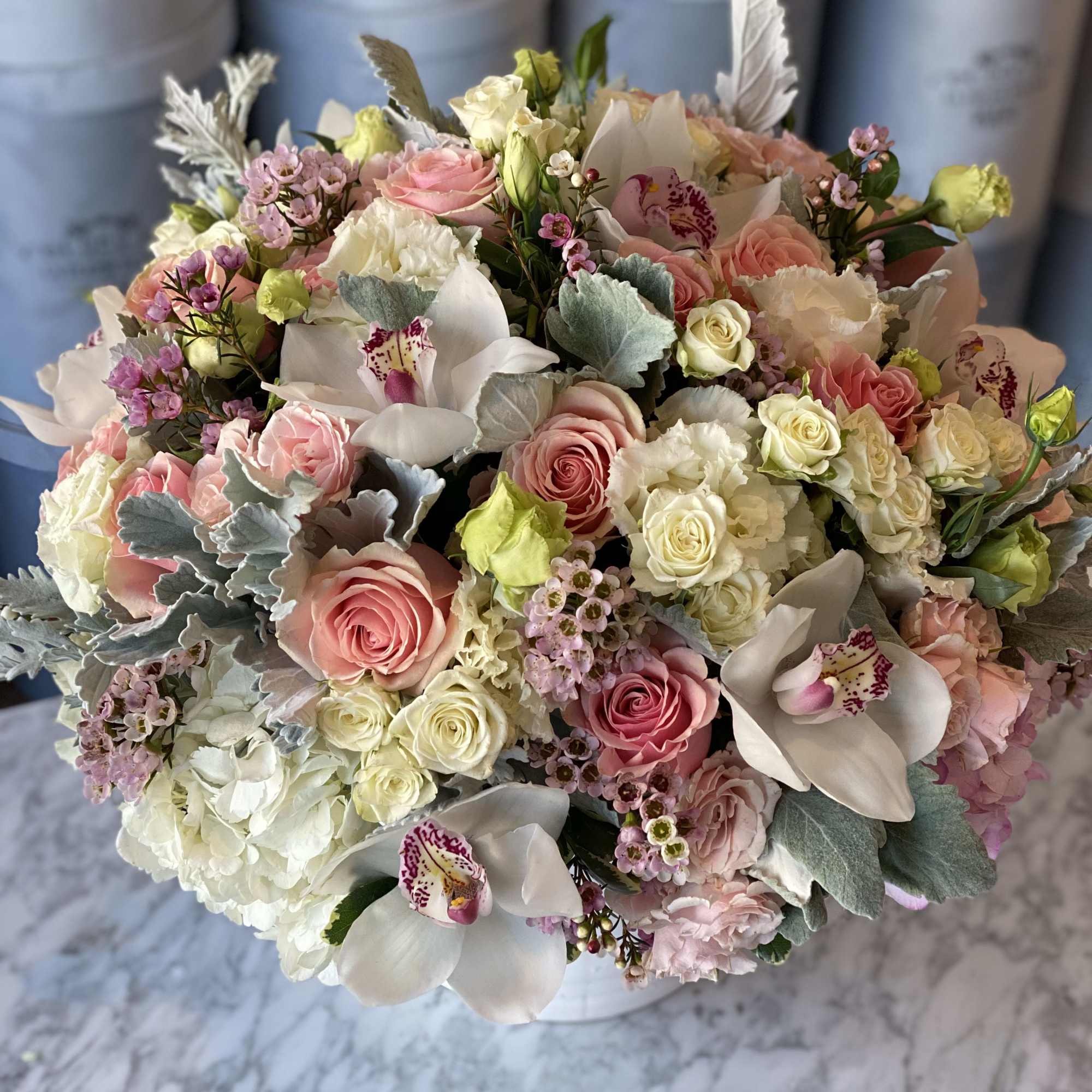 White ceramic vase with pastel tone mix flower arrangement.  White ceramic vase with pastel tone mix flower arrangement.