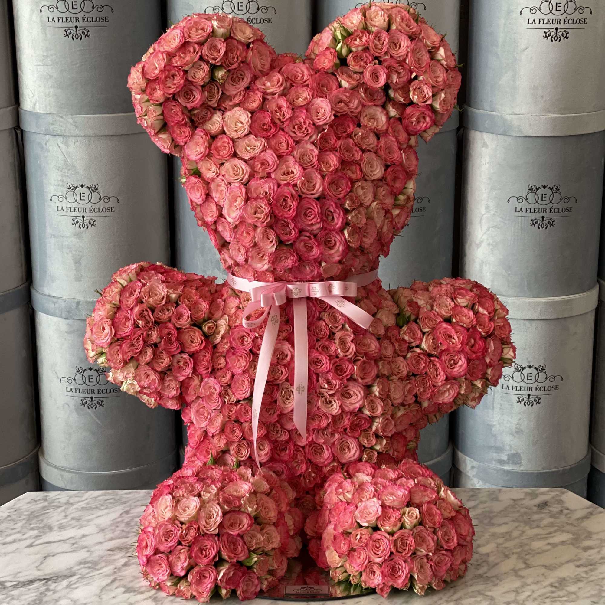 2 foot teddy bear with pink baby roses.    2 foot teddy bear with pink baby roses.