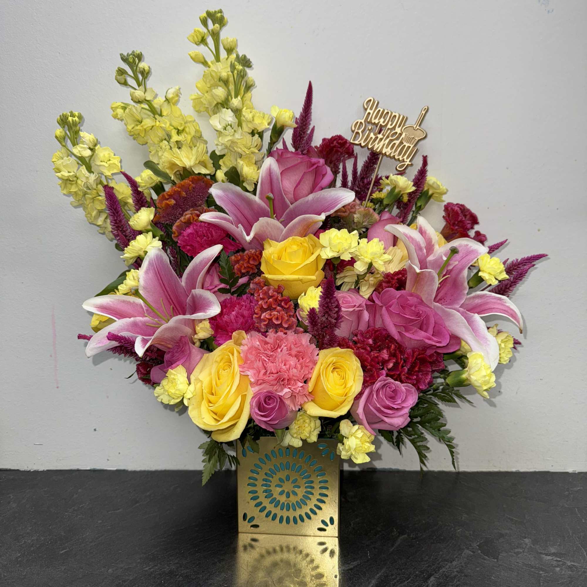 A joyful burst of color, this birthday arrangement shines with golden yellow A joyful burst of color, this birthday arrangement shines with golden yellow