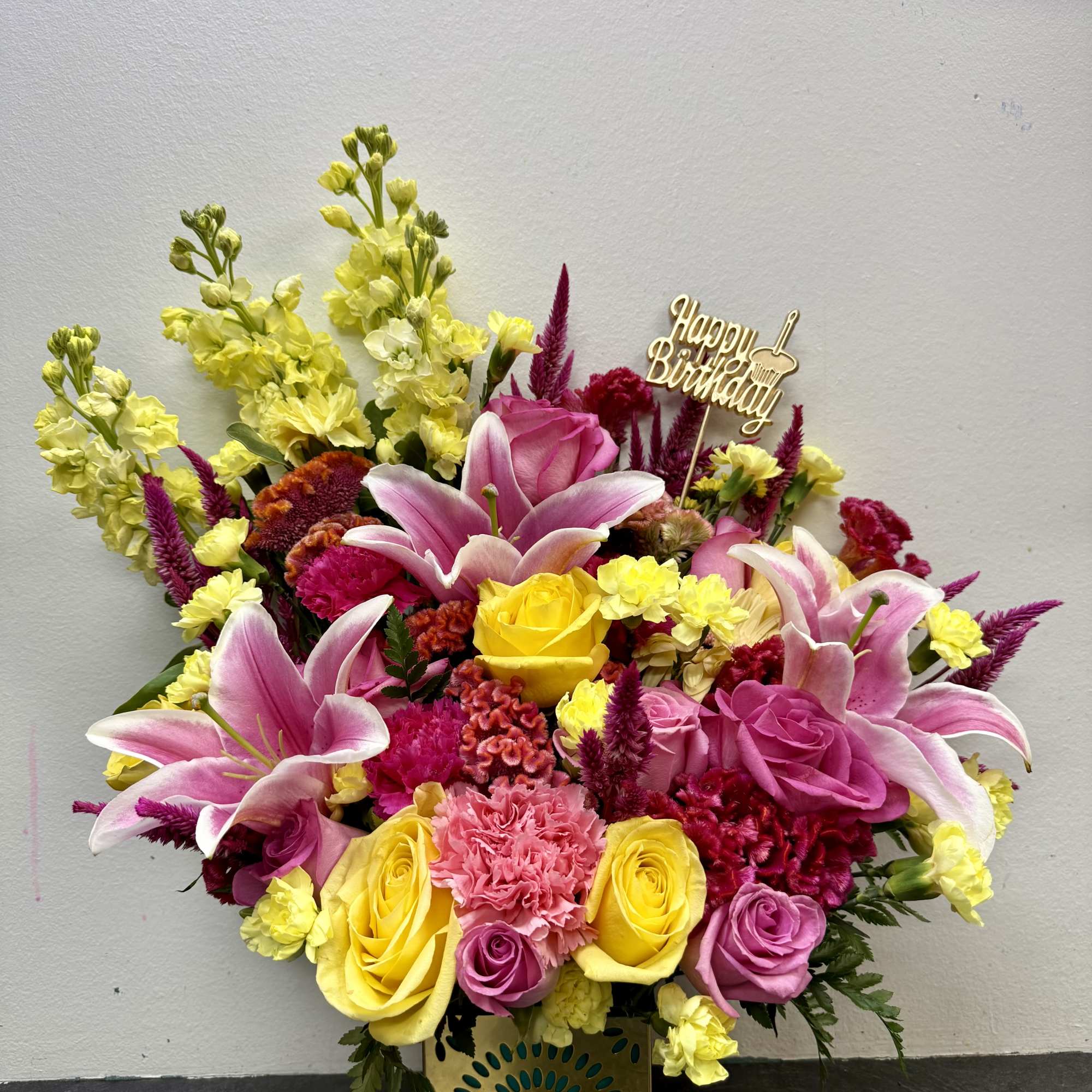 A joyful burst of color, this birthday arrangement shines with golden yellow A joyful burst of color, this birthday arrangement shines with golden yellow