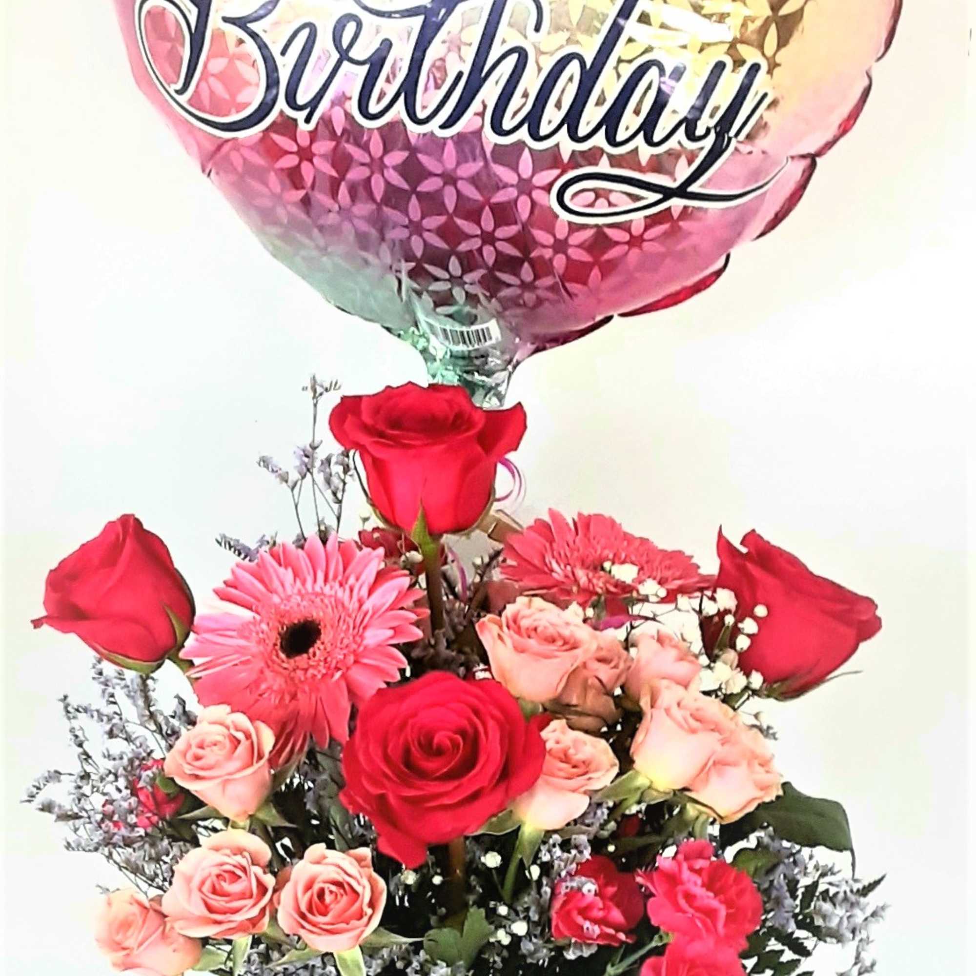 Beautiful roses,gerbera daisies, spray roses,mini carnations, with feminine fillers and greenery,accented by