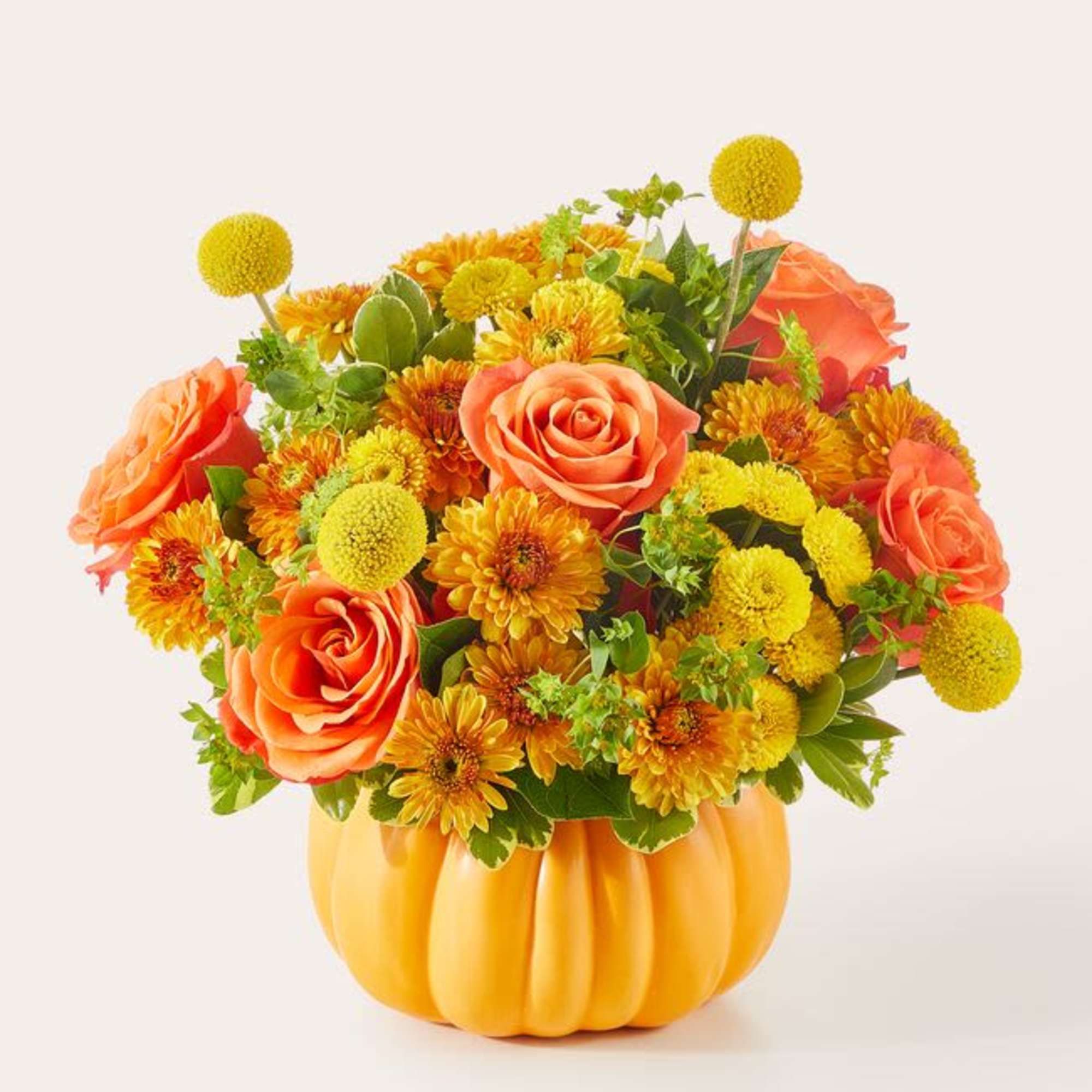 This fun fall festive floral mix arrives in a keepsake orange ceramic This fun fall festive floral mix arrives in a keepsake orange ceramic