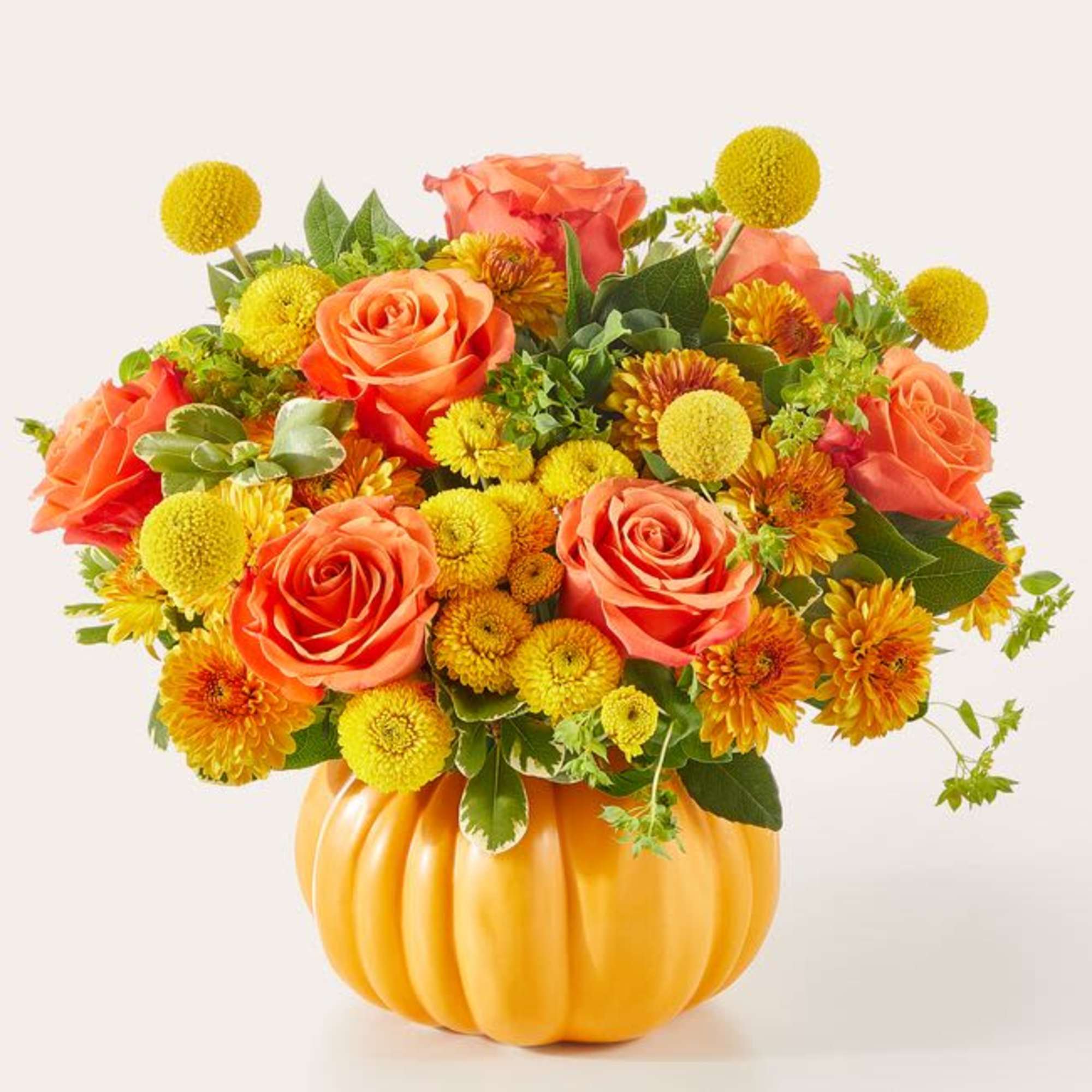 This fun fall festive floral mix arrives in a keepsake orange ceramic This fun fall festive floral mix arrives in a keepsake orange ceramic