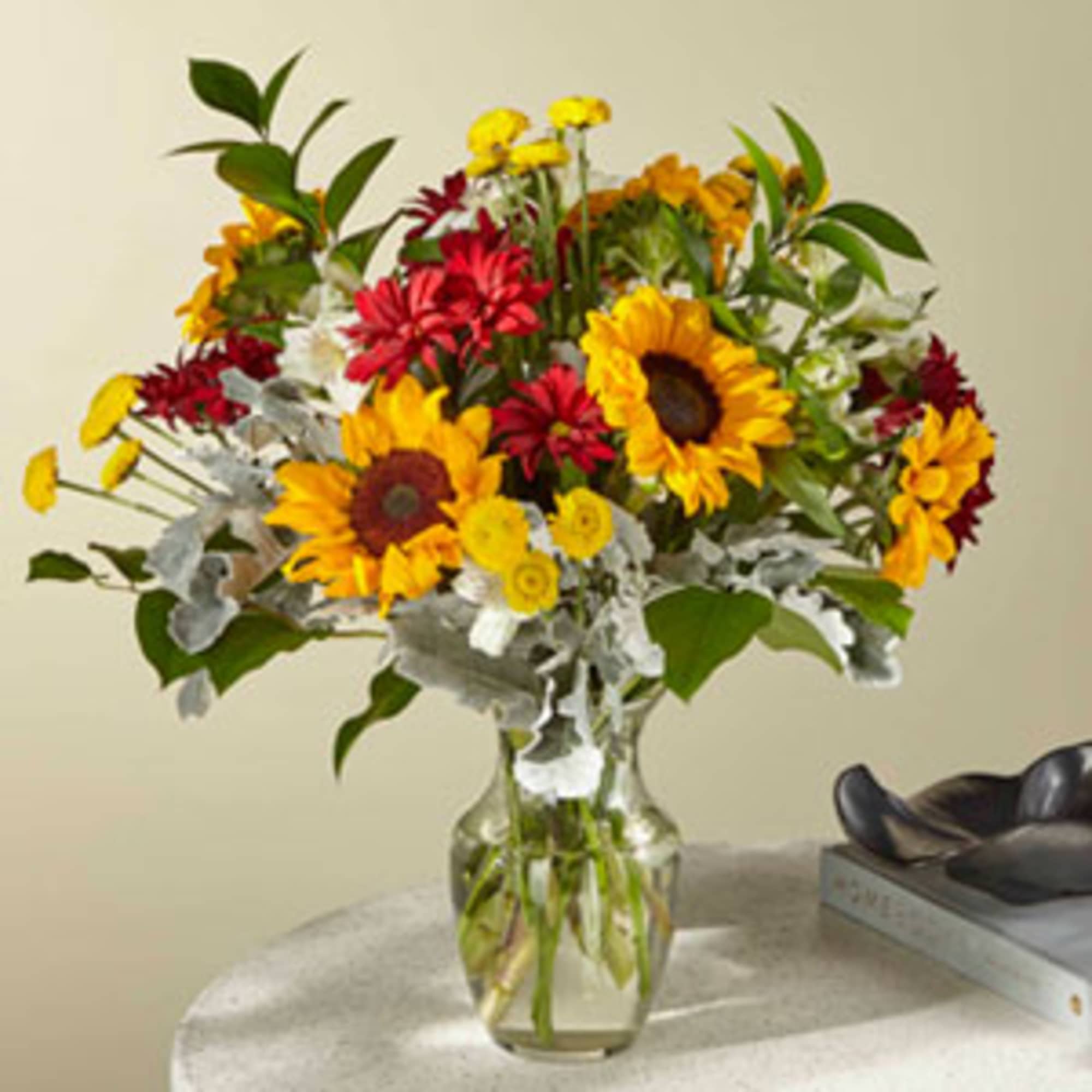 Sunflowers and bronze daisy pompons create bold contrast in this eye-catching bucolic