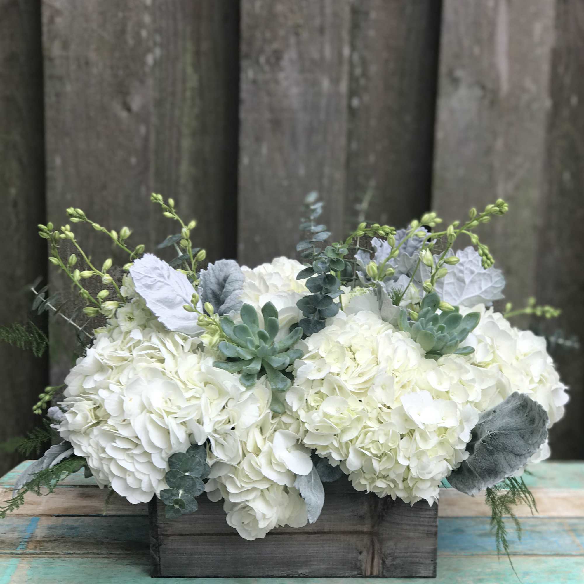 Cool, crisp white blooms with shades of green keep it fresh and