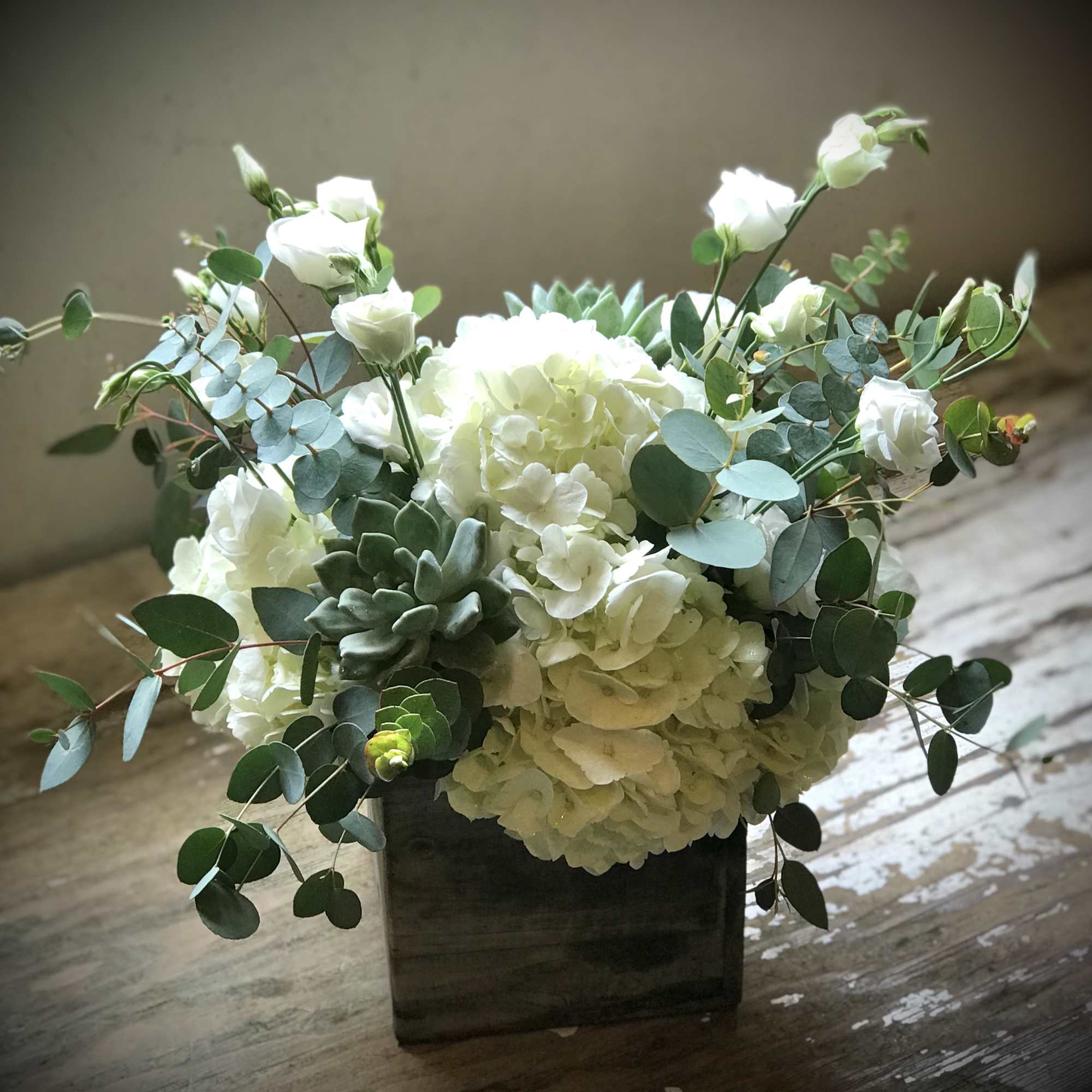 Cool, crisp white blooms with shades of green keep it fresh and