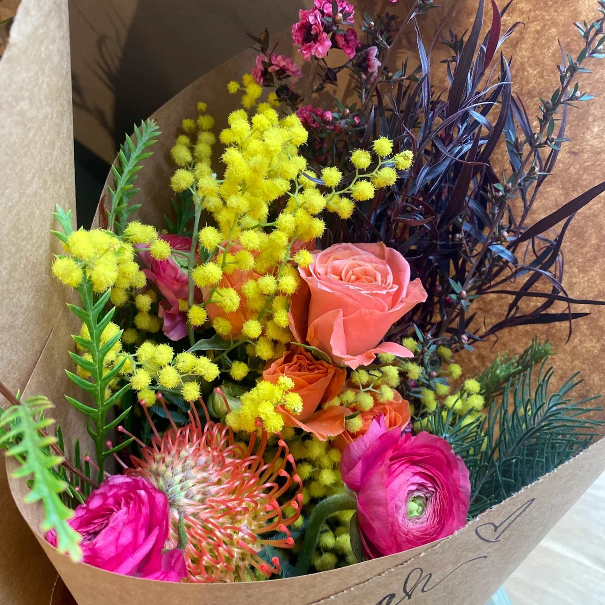 An abundant, hand-tied bouquet &mdash; gathered with whatever is most beautiful in