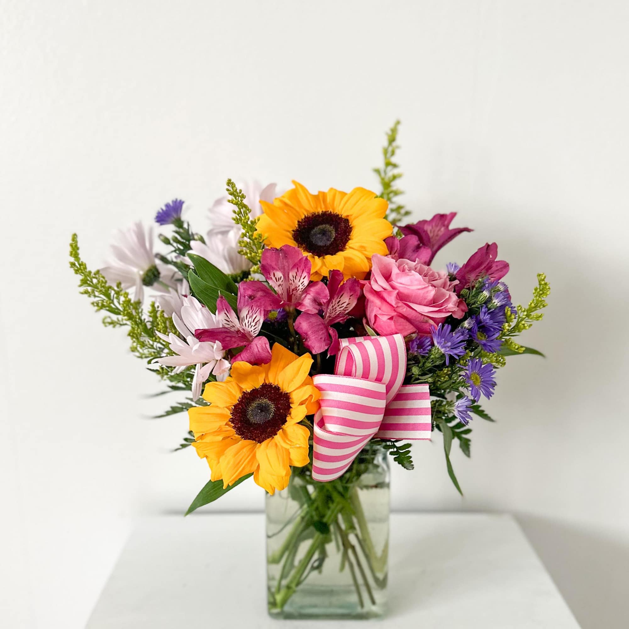 Sunny Day includes sunflowers, alstroemeria, daisies, and more! 
May need to substitute Sunny Day includes sunflowers, alstroemeria, daisies, and more! 
May need to substitute